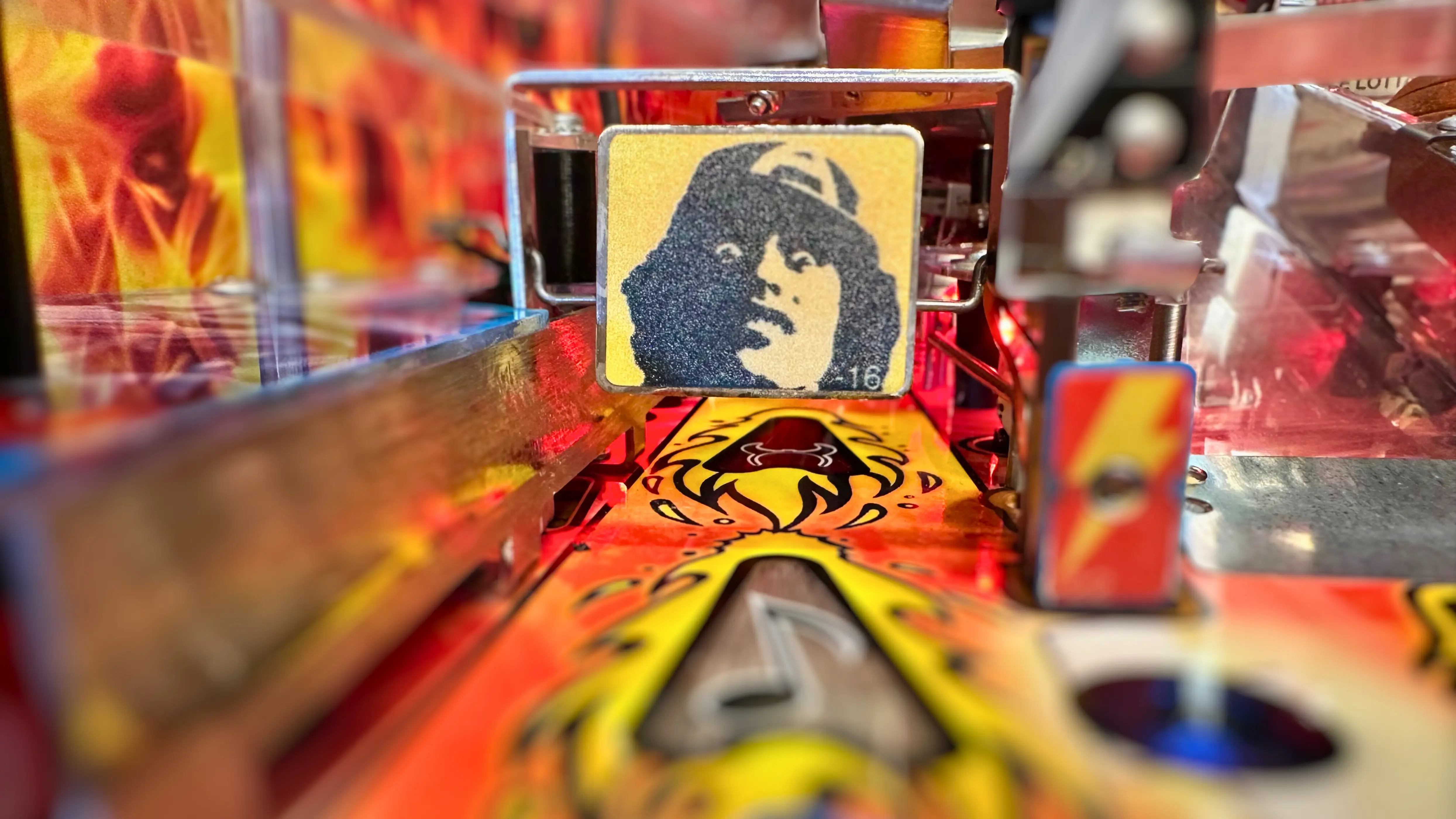 Stylized portrait tile with black silhouette on yellow background