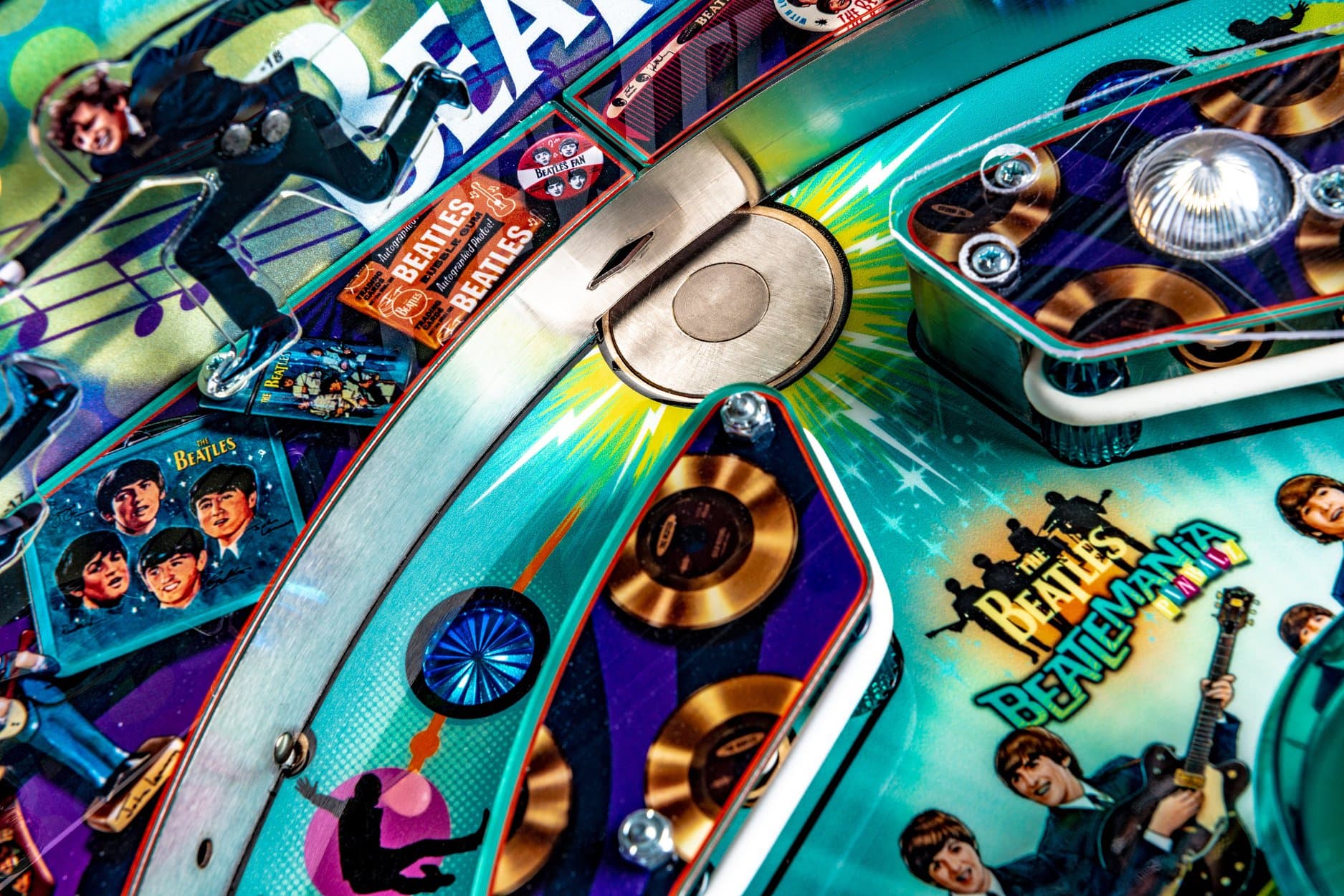 Colorful Beatles-themed pinball machine with band imagery and music icons