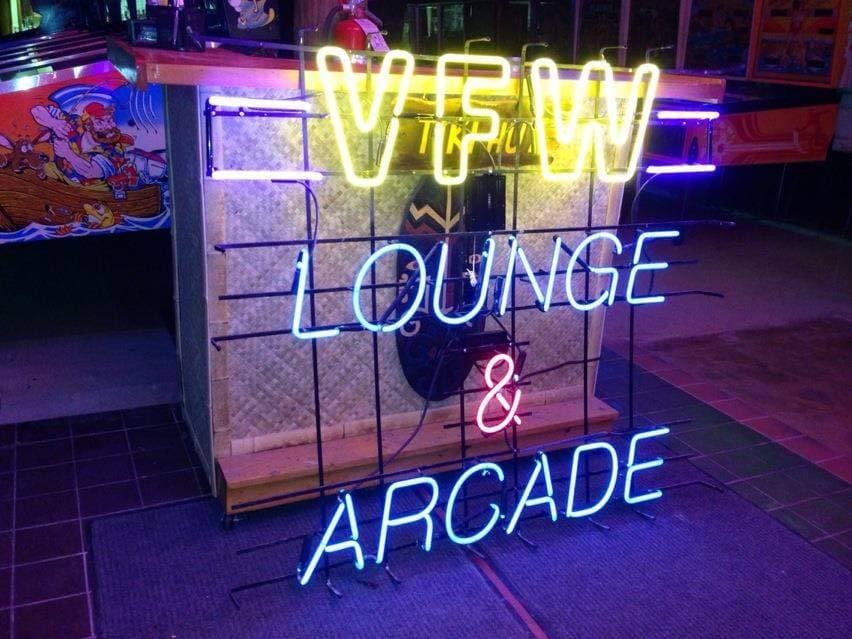 Colorful neon sign for VFW Lounge and Arcade with vibrant lighting