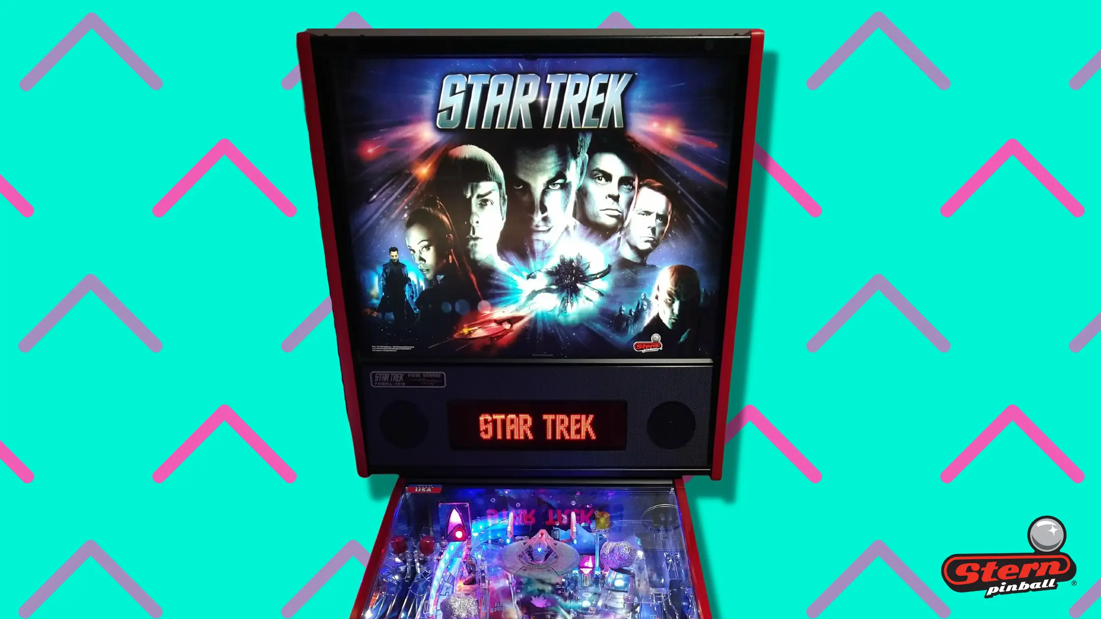 Star Trek pinball machine with colorful backglass and illuminated playfield