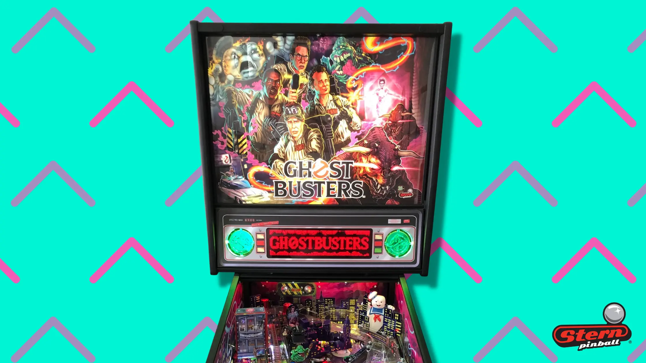 Ghostbusters pinball machine with colorful artwork and game playfield