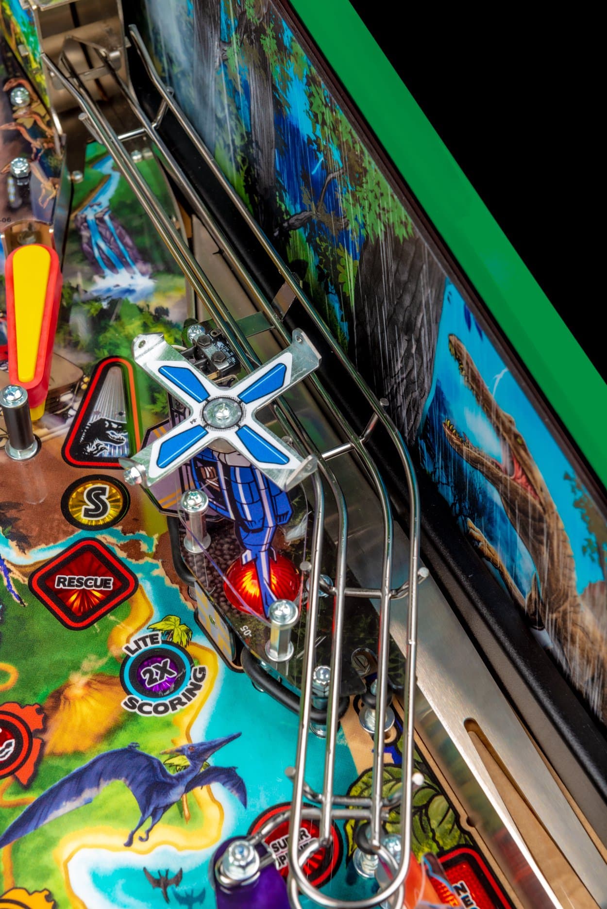 Colorful pinball machine with rescue and scoring elements, dinosaur graphics