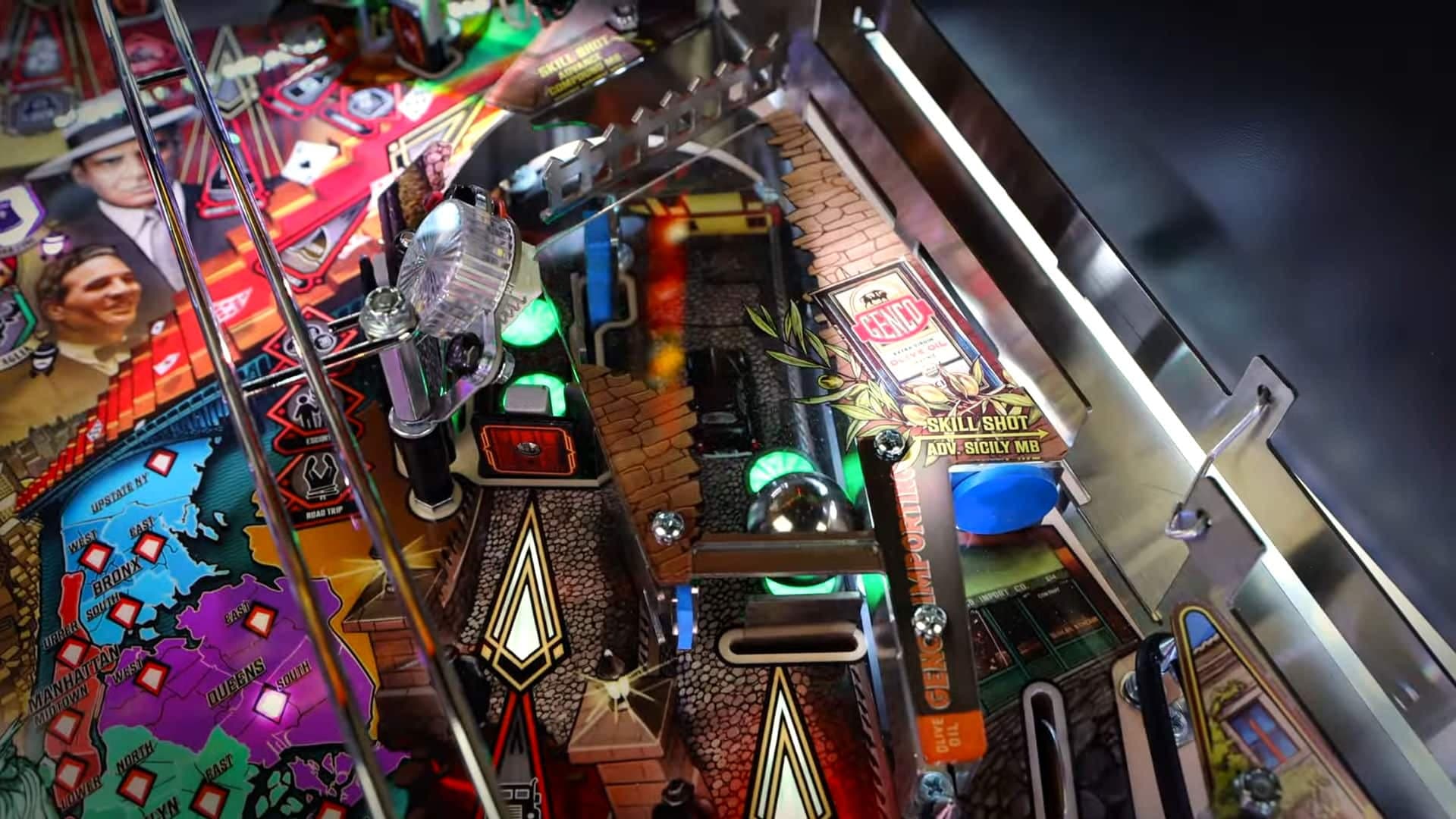 Colorful pinball machine with flippers, lights, and intricate game board details
