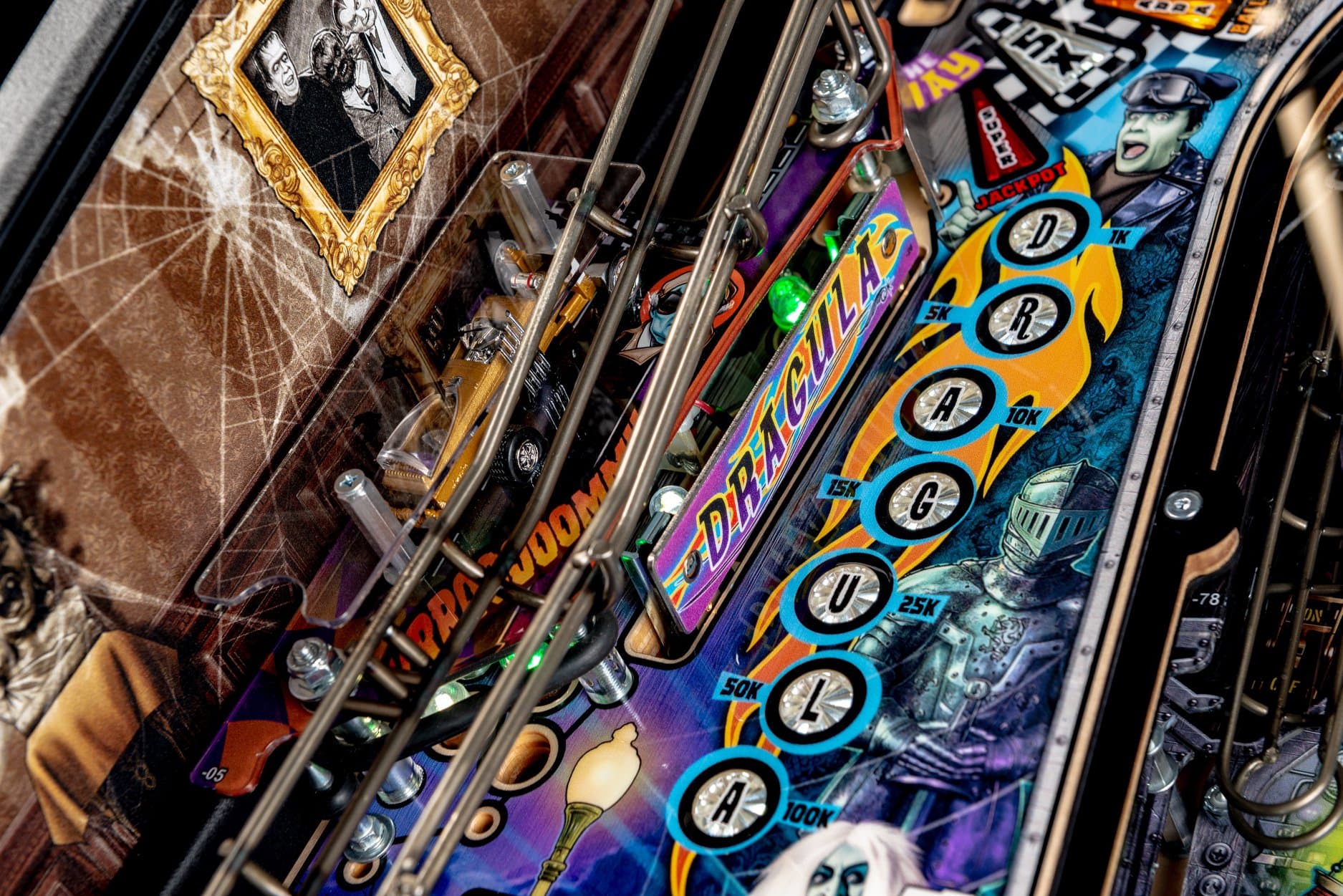 Colorful pinball machine with intricate design and scoring lights