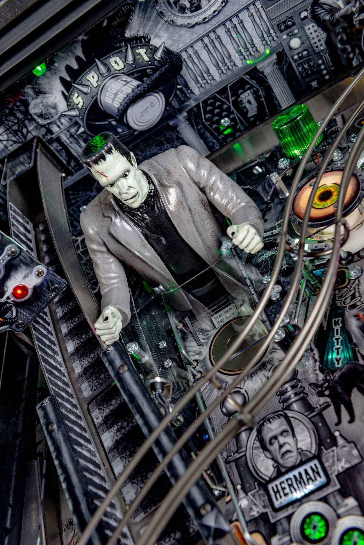 Vintage Frankenstein figure amid complex mechanical steampunk machinery