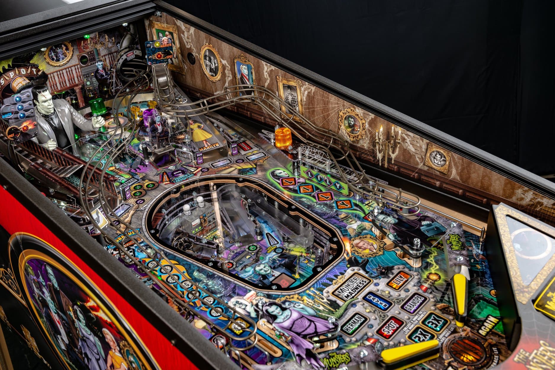 Detailed Monsters-themed pinball machine with colorful playfield and intricate design