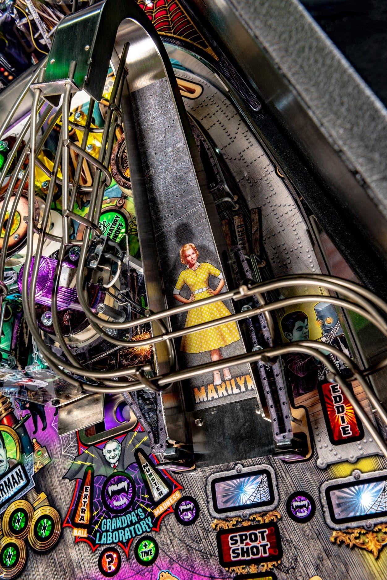 Vintage pinball machine with retro woman, complex mechanical details, colorful design