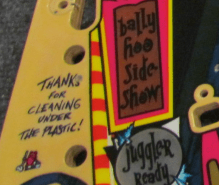 Colorful poster with handwritten notes about cleaning and a juggler show