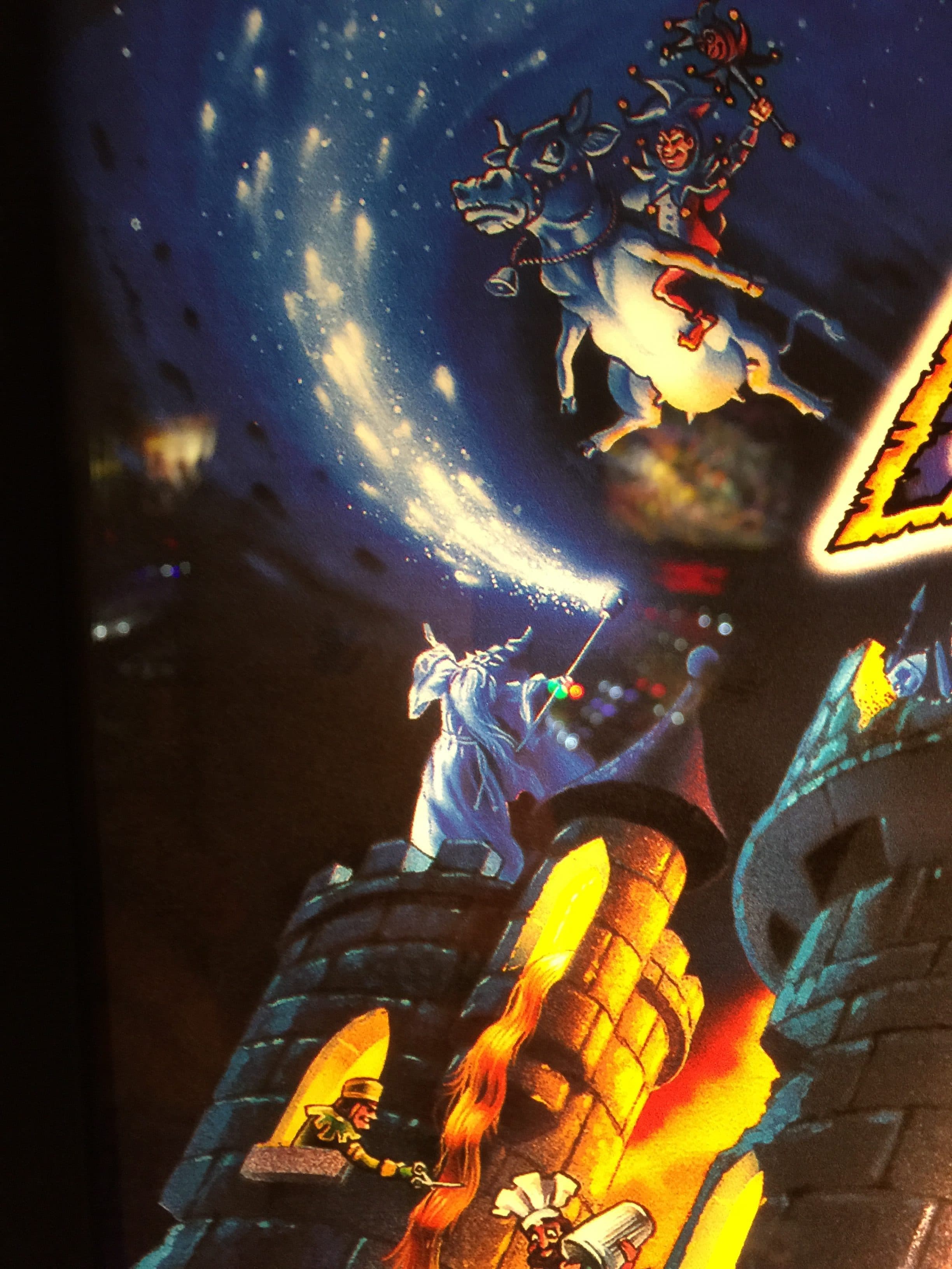 Magical wizard battles rider on fantastical creature amid starry night