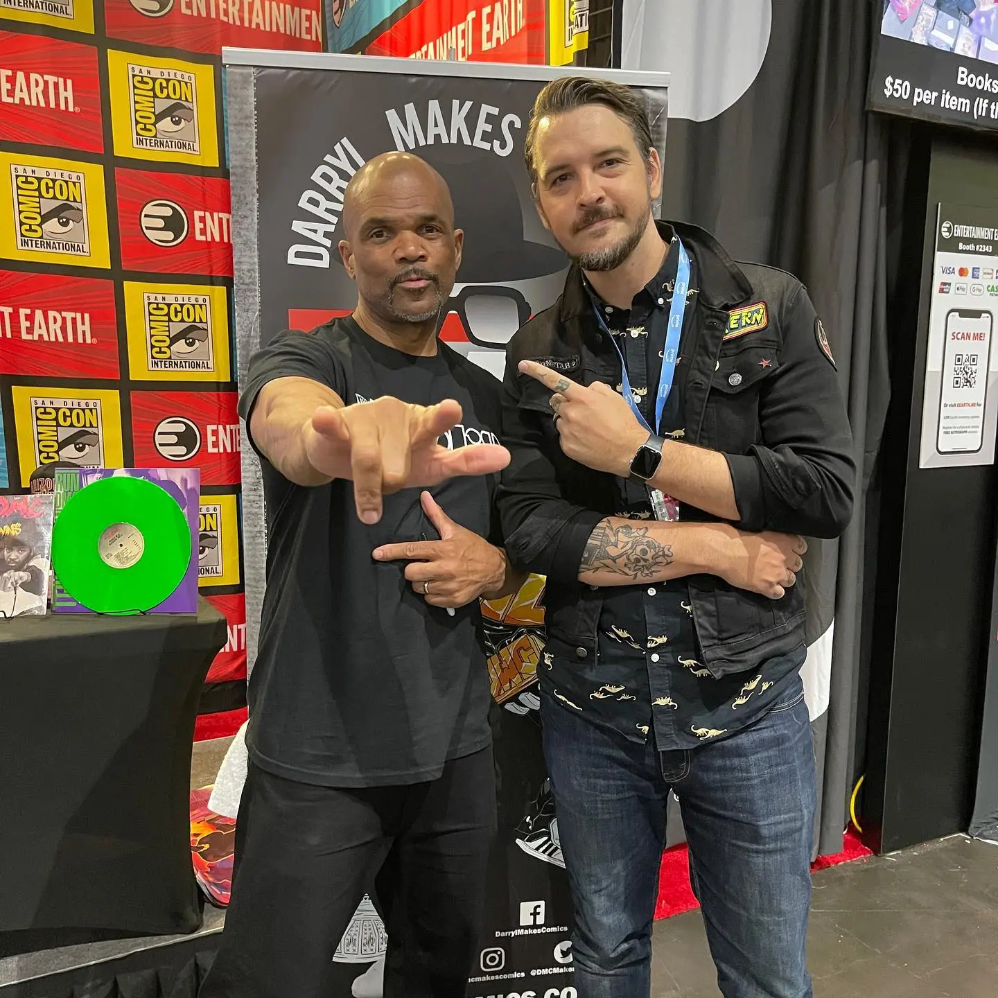 Two men posing at San Diego Comic-Con International entertainment booth
