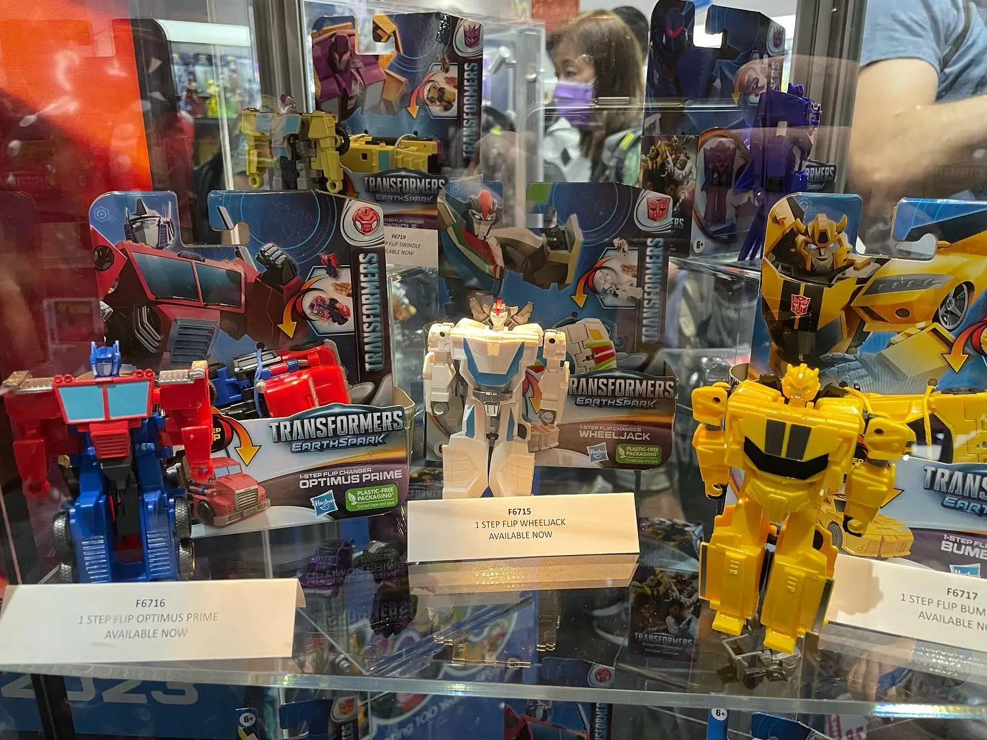 Transformers EarthSpark toy display with Optimus Prime and Bumblebee