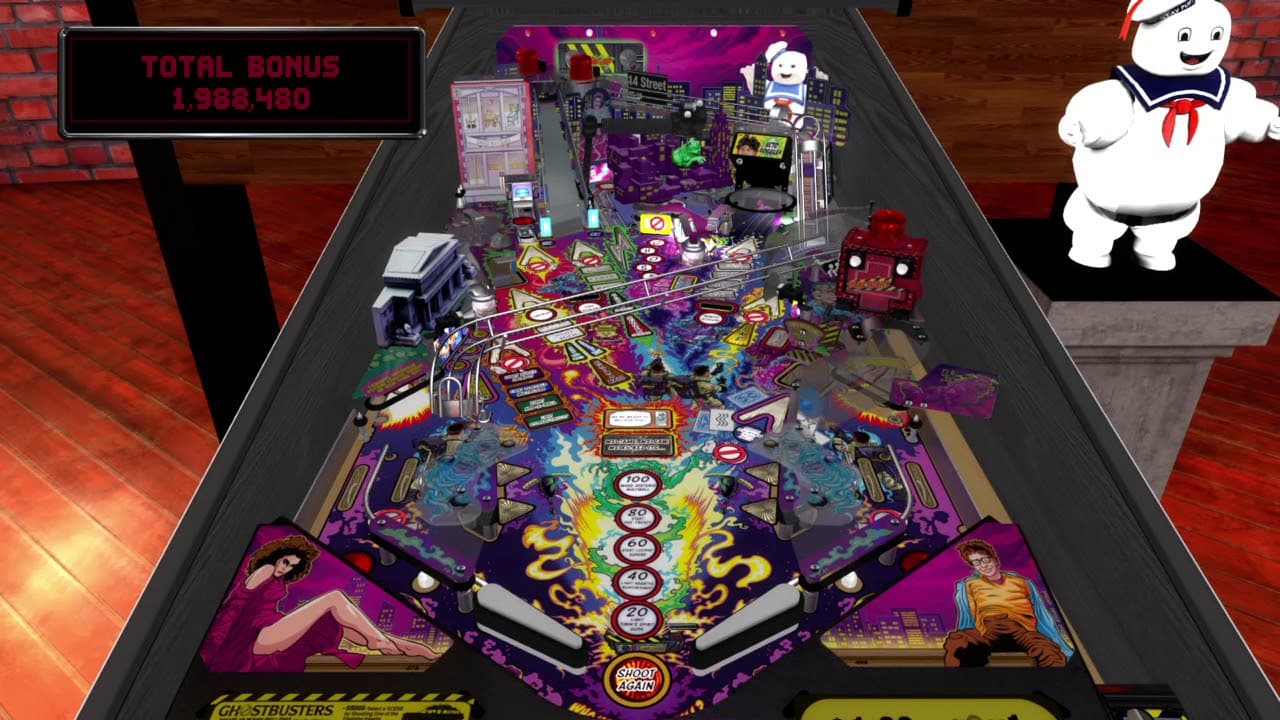 Ghostbusters-themed pinball machine with colorful playfield and Stay Puft Marshmallow Man