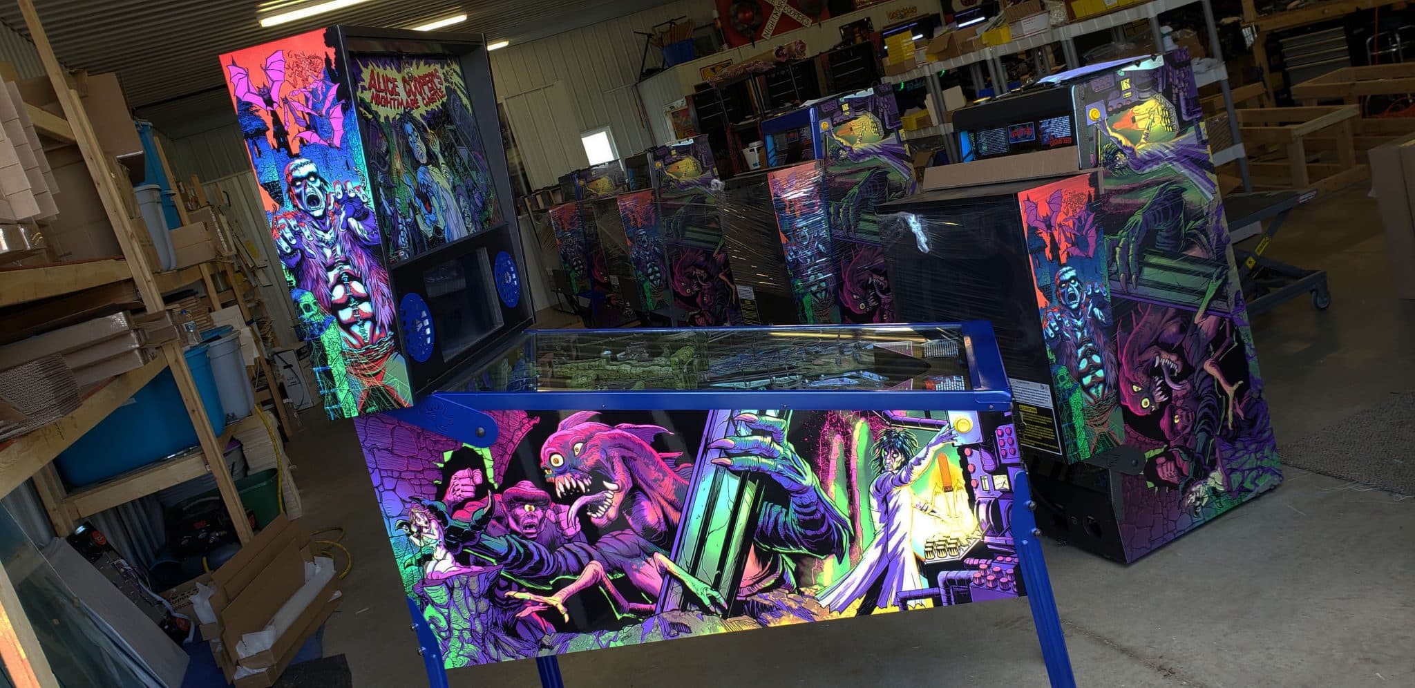 Colorful arcade pinball machine with horror-themed psychedelic artwork