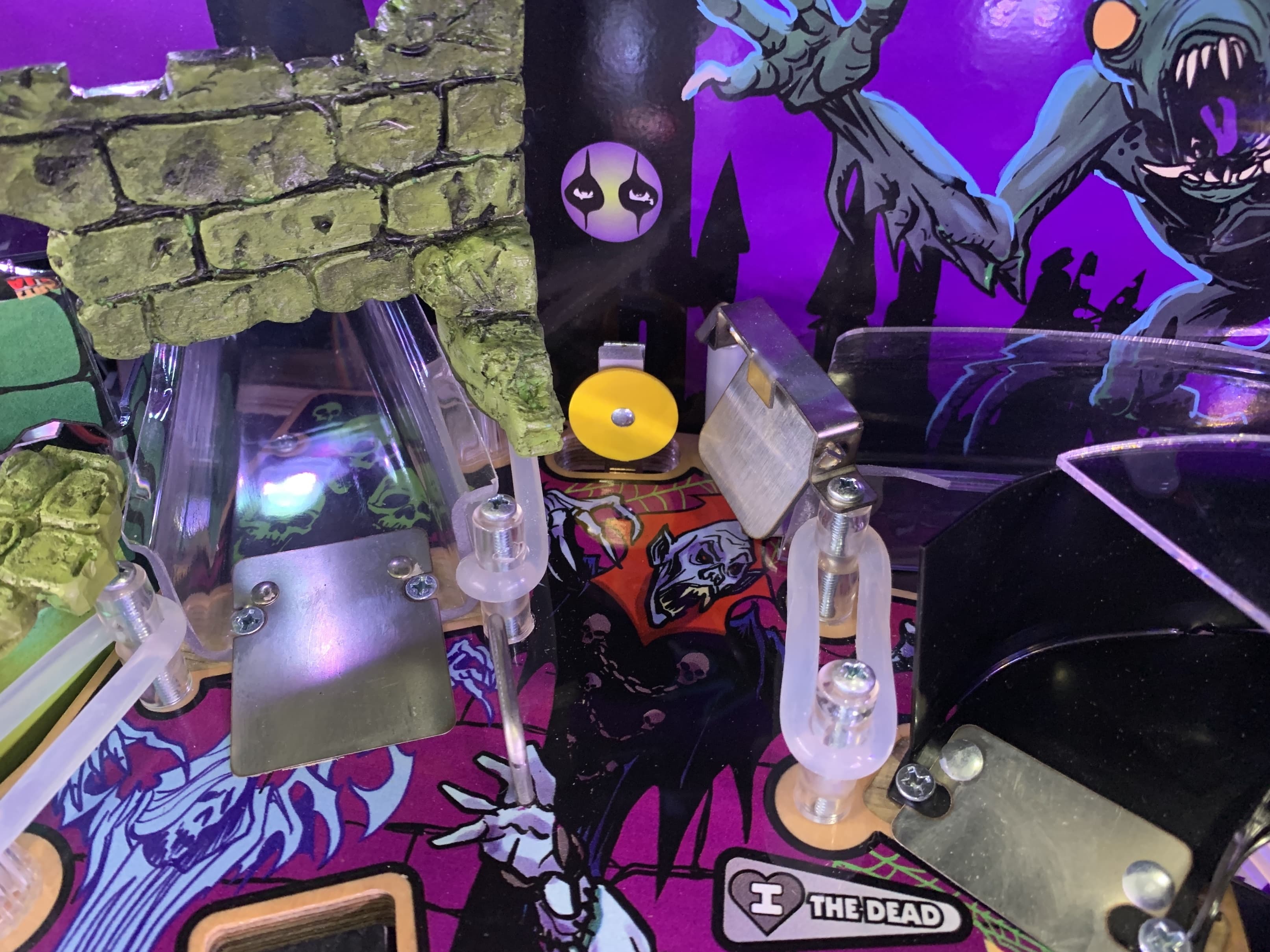 Pinball machine with gothic and monster-themed artwork in purple tones