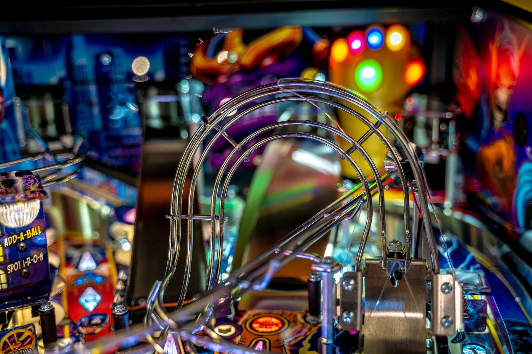 Colorful pinball machine with metal ramps and vibrant flashing lights