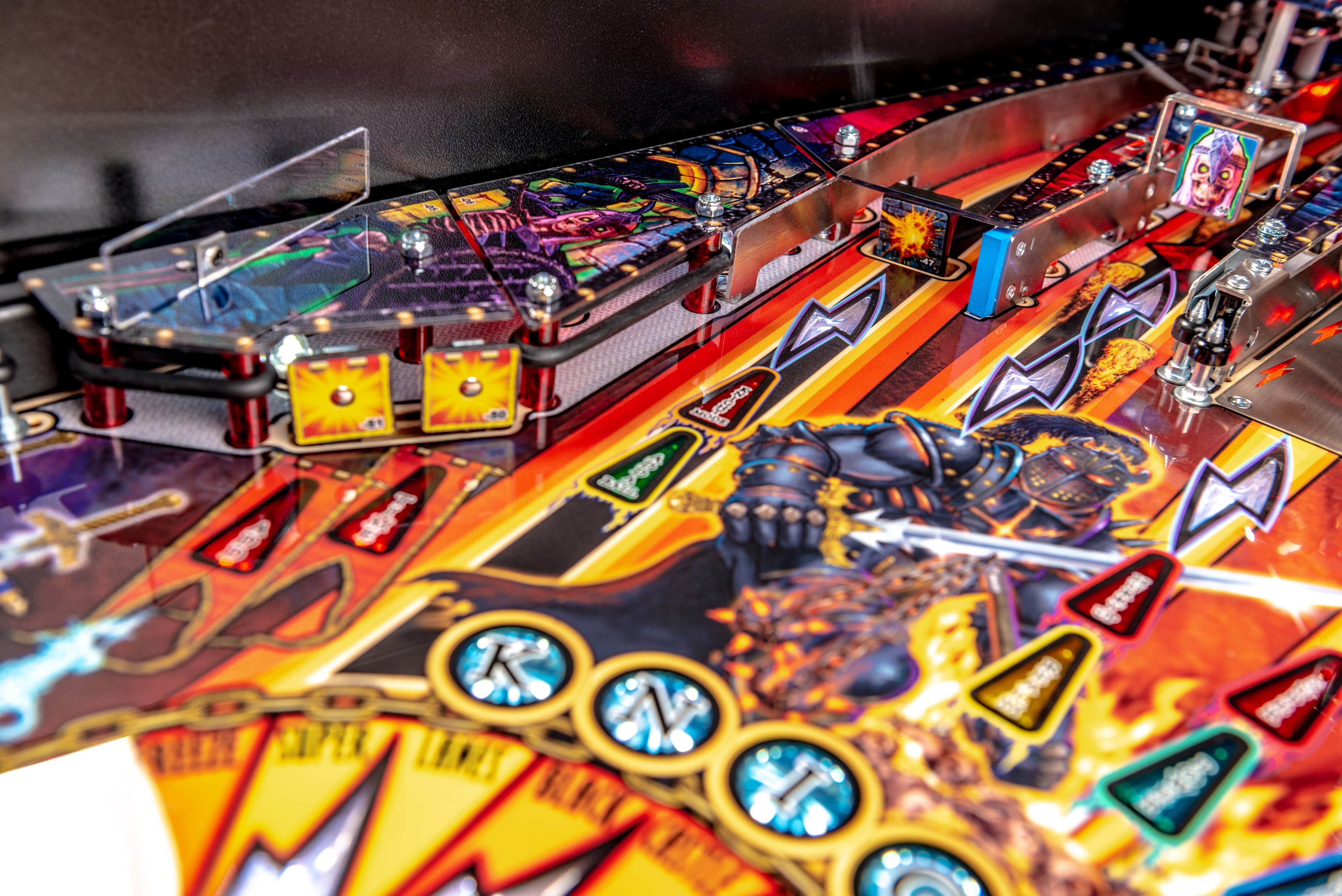 Colorful pinball machine with vibrant artwork and metallic game elements