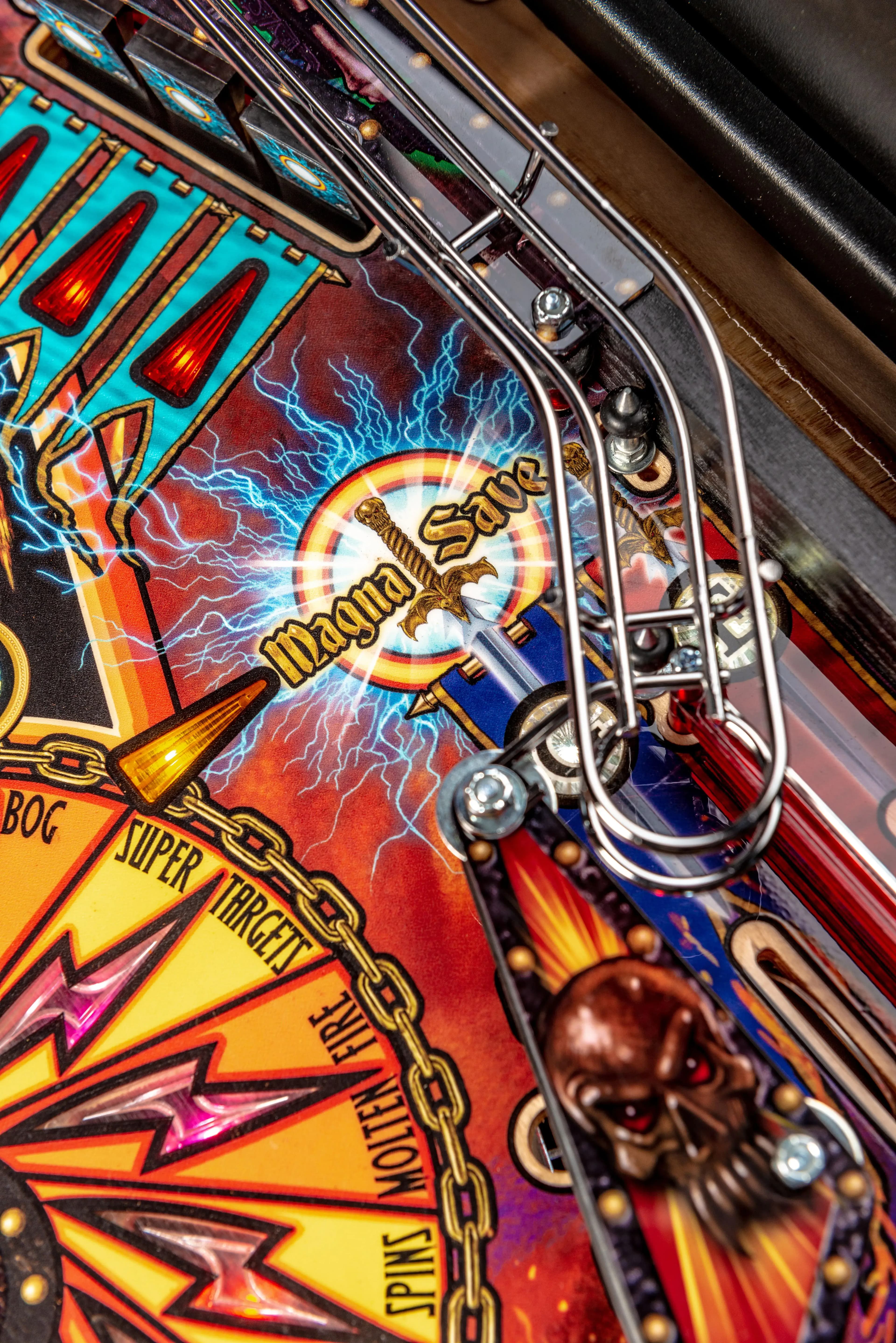 Colorful pinball machine detail with Magna Sage logo and lightning effect