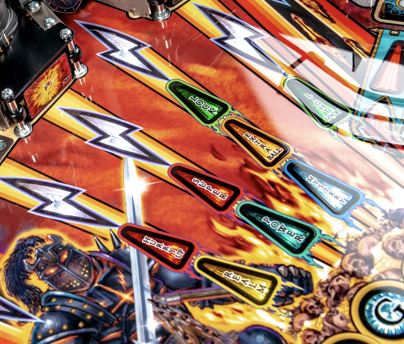 Colorful pinball machine playfield with lightning bolts and game lanes