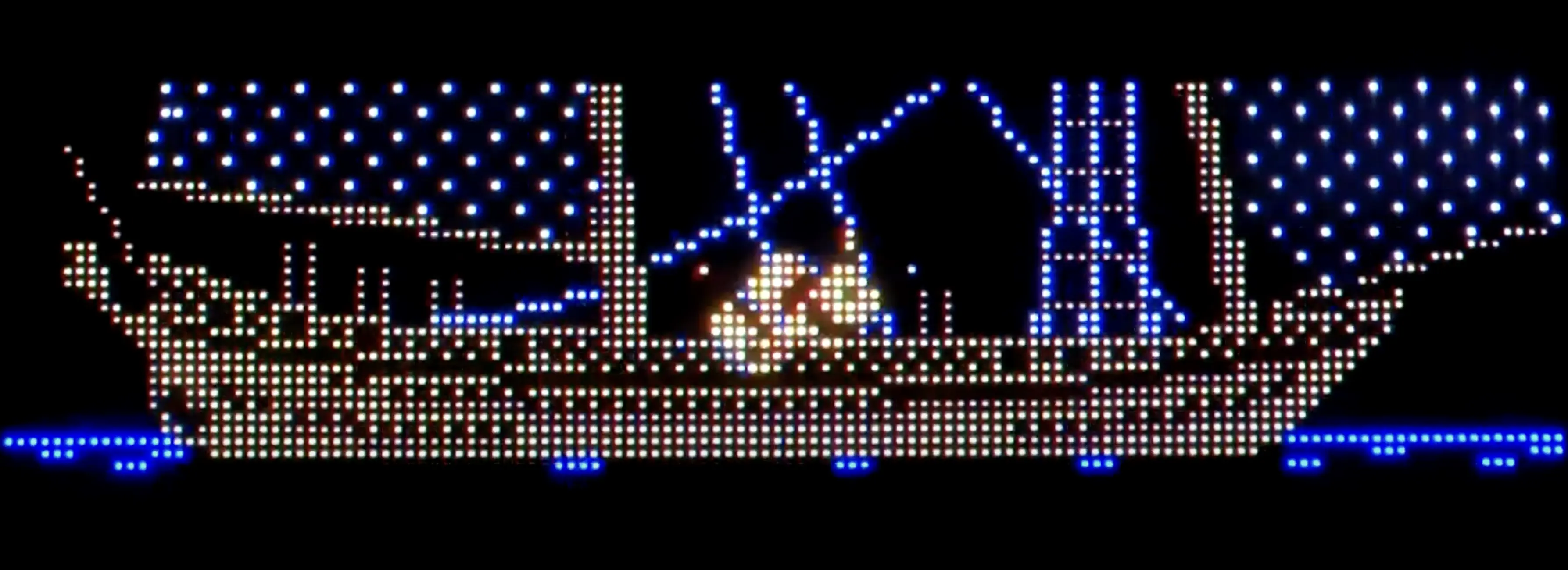 Pixelated ship with glowing blue lights against a black background
