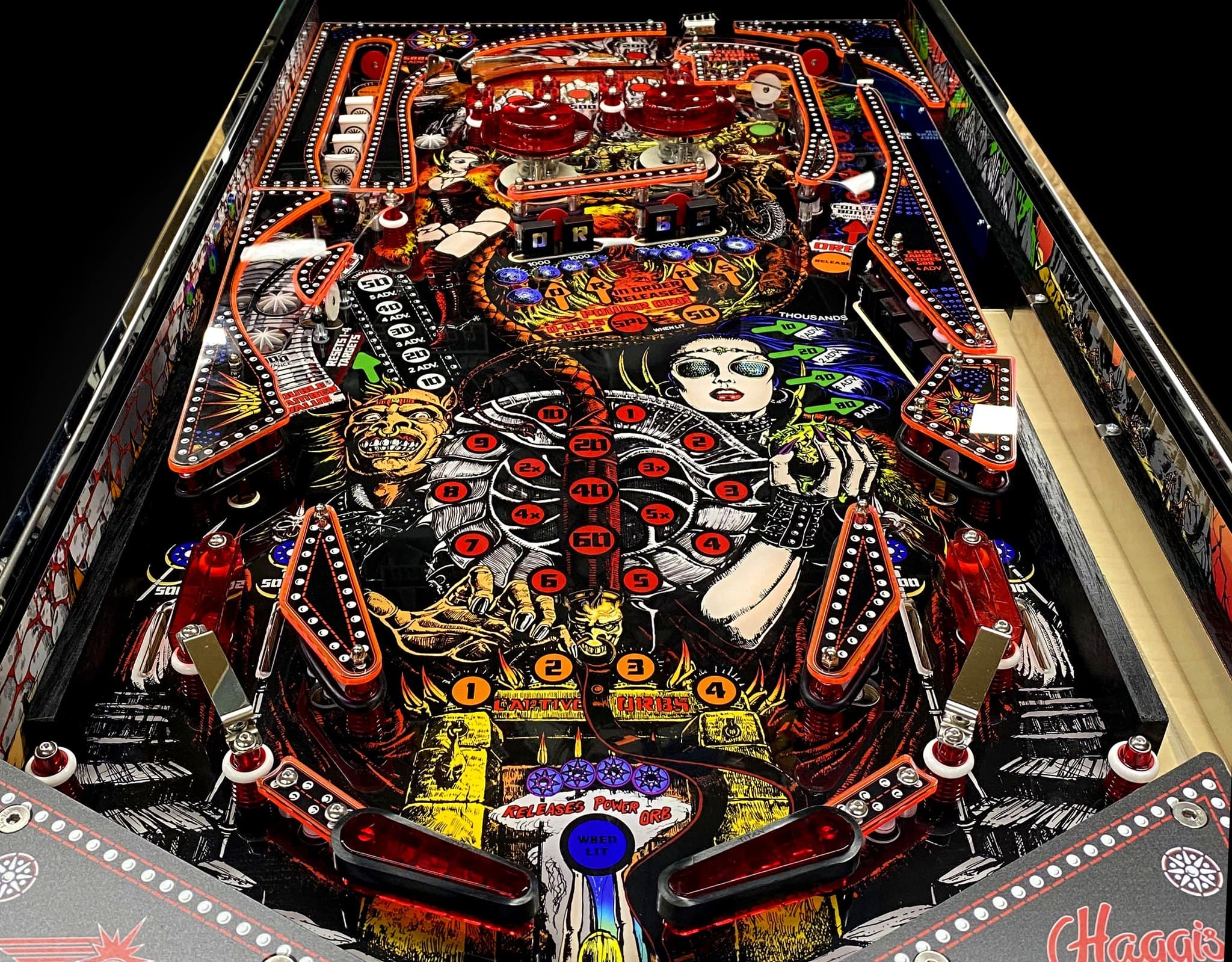 Colorful vintage pinball machine with intricate gothic-style artwork and flippers