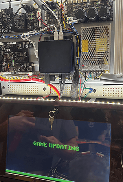 Computer system interior with 'Game Updating' screen and electronic components
