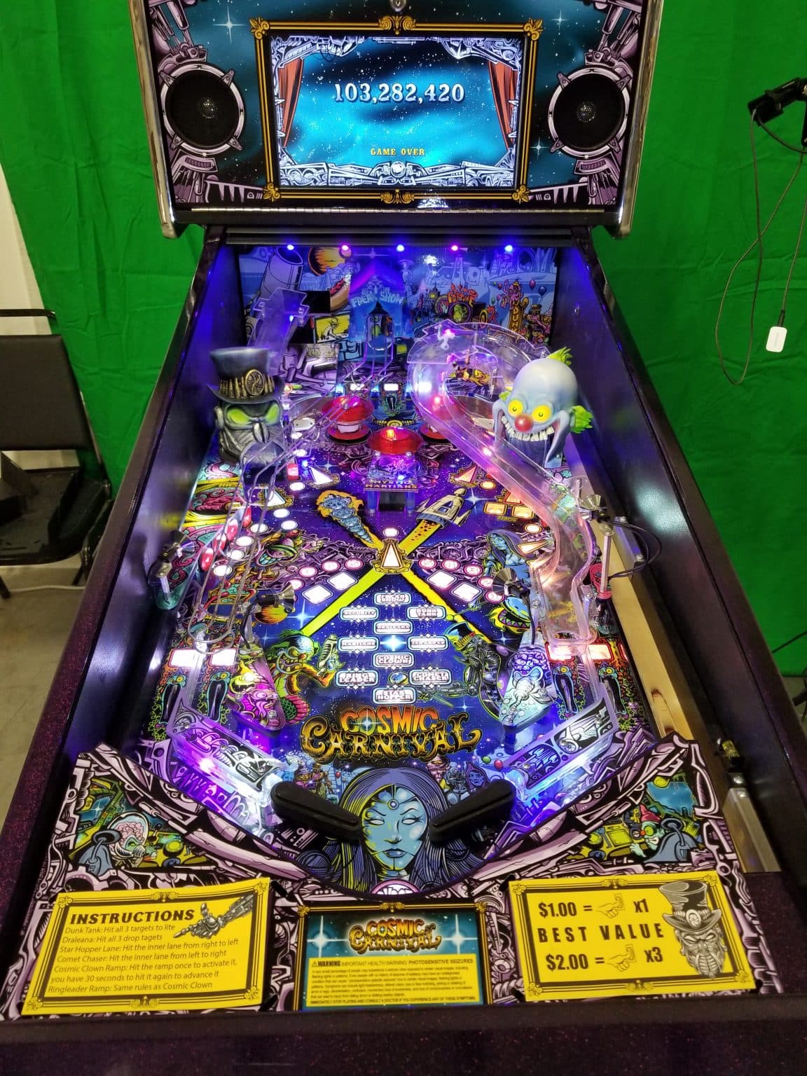 Cosmic Carnival pinball machine with colorful playfield and illuminated scoring display