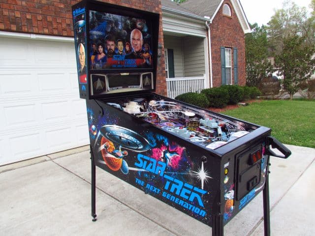 Star Trek: The Next Generation pinball machine on residential driveway