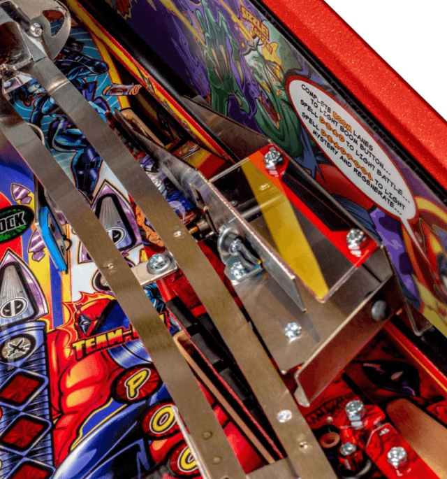 Colorful pinball machine interior with metal components and vibrant artwork