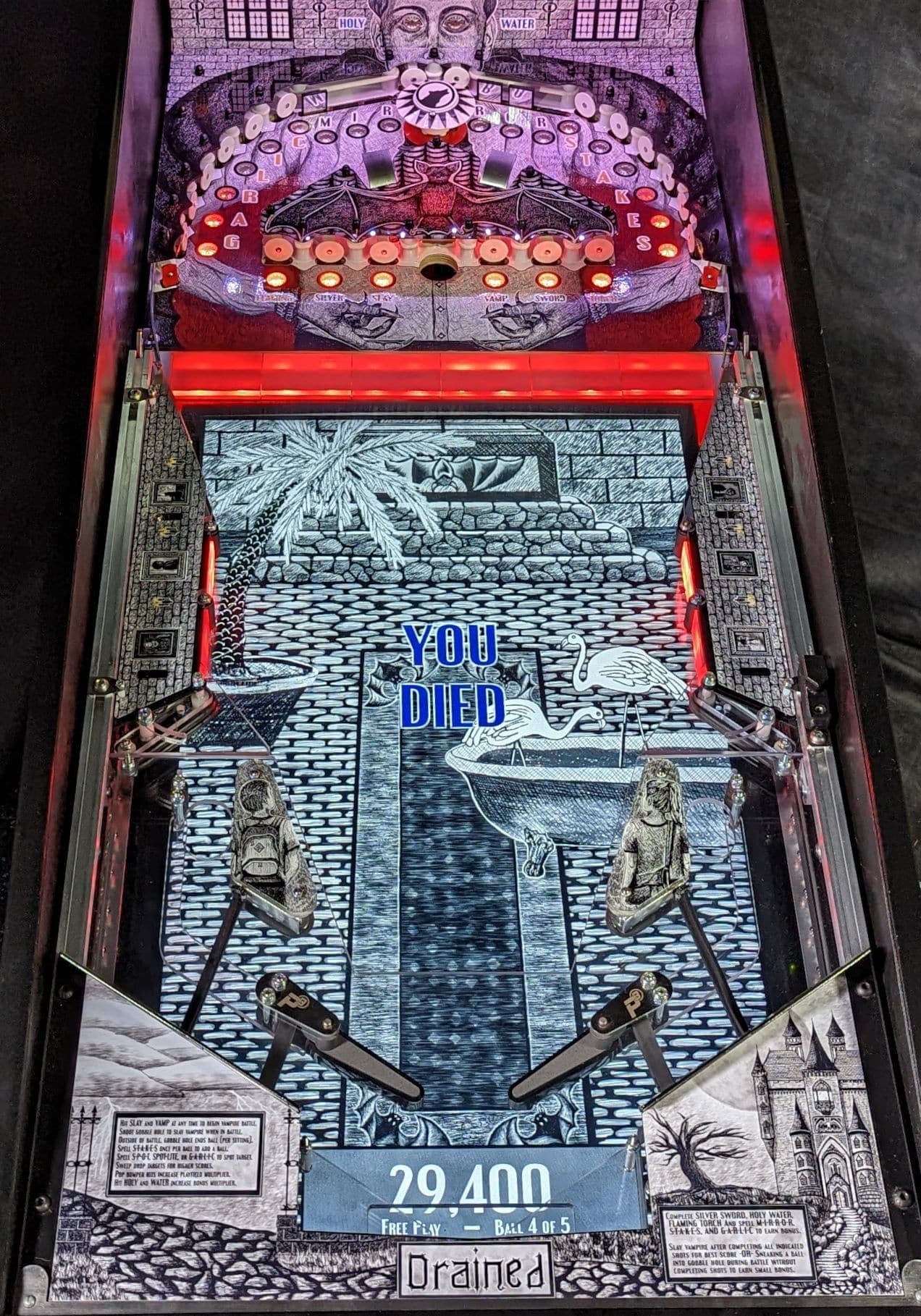 Detailed gothic-themed pinball machine with "You Died" message