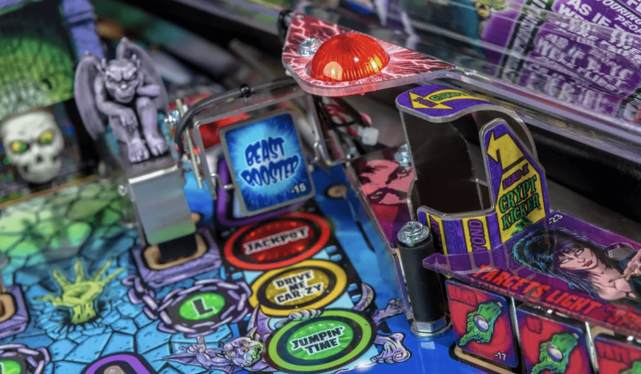 Colorful pinball machine with various game targets and decorative elements