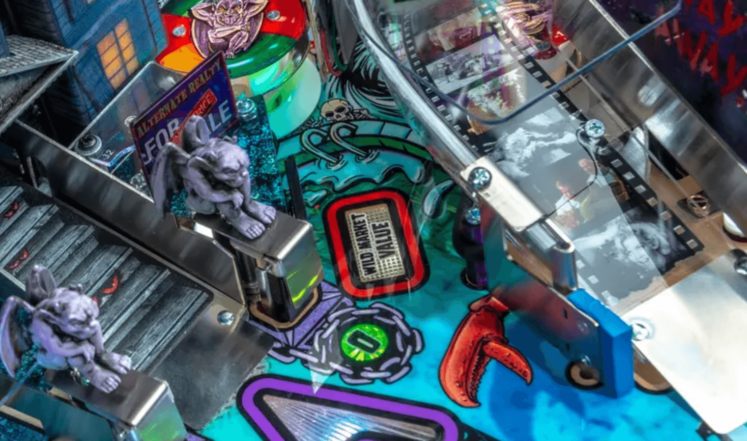 Colorful pinball machine with gargoyle statues and intricate design elements