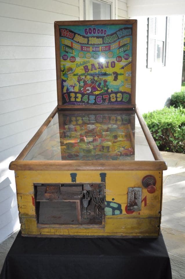 Vintage bingo pinball machine with colorful yellow and blue design