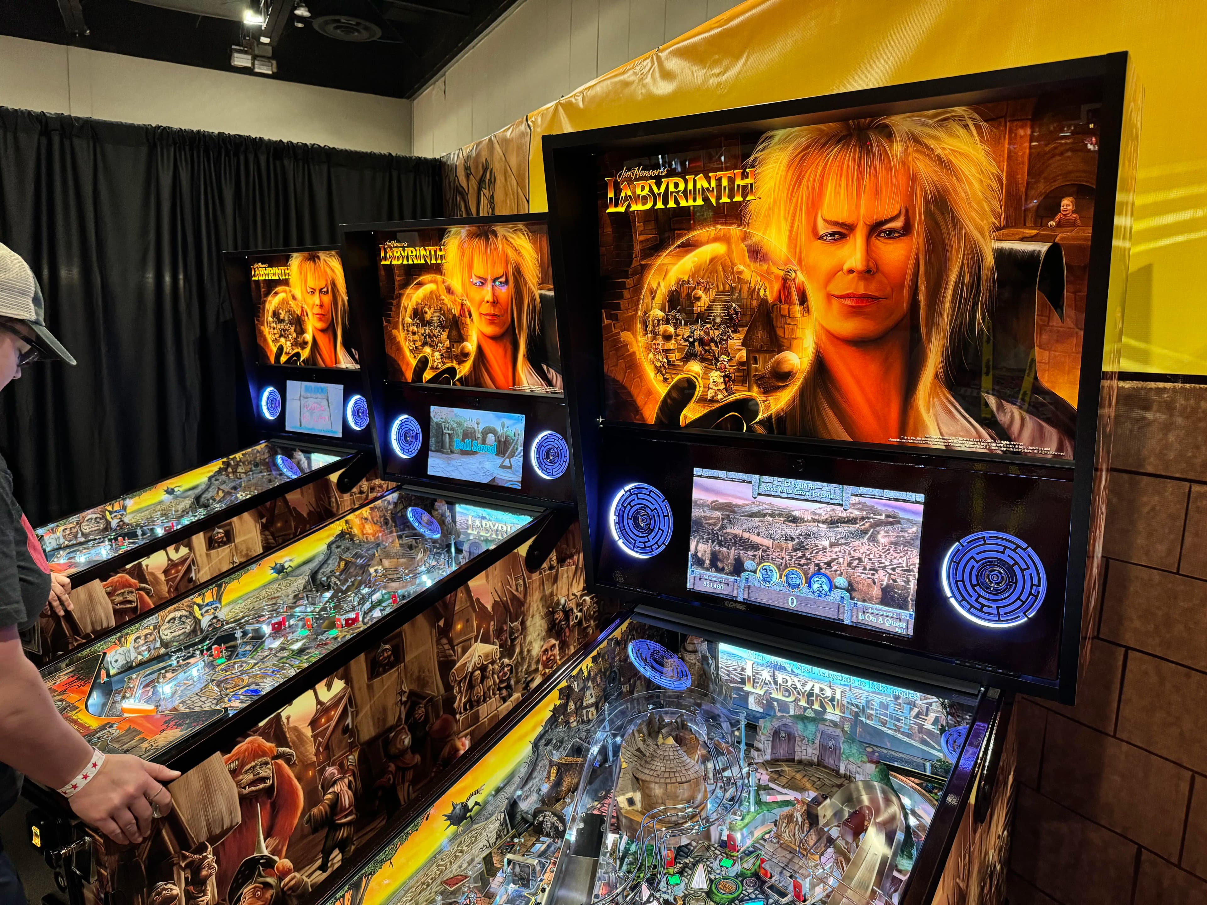 Labyrinth pinball machine with detailed movie artwork and glowing blue screens