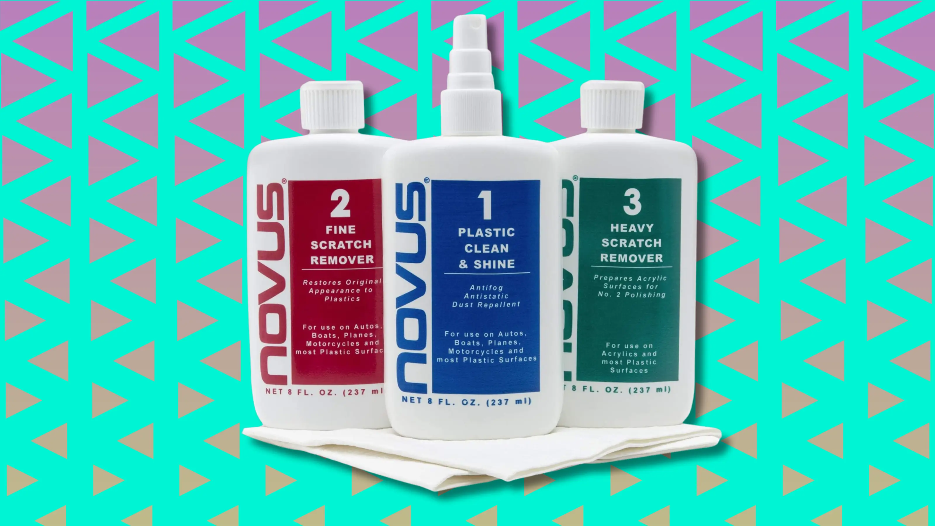 Three Novus plastic cleaning and scratch removal bottles on white cloth