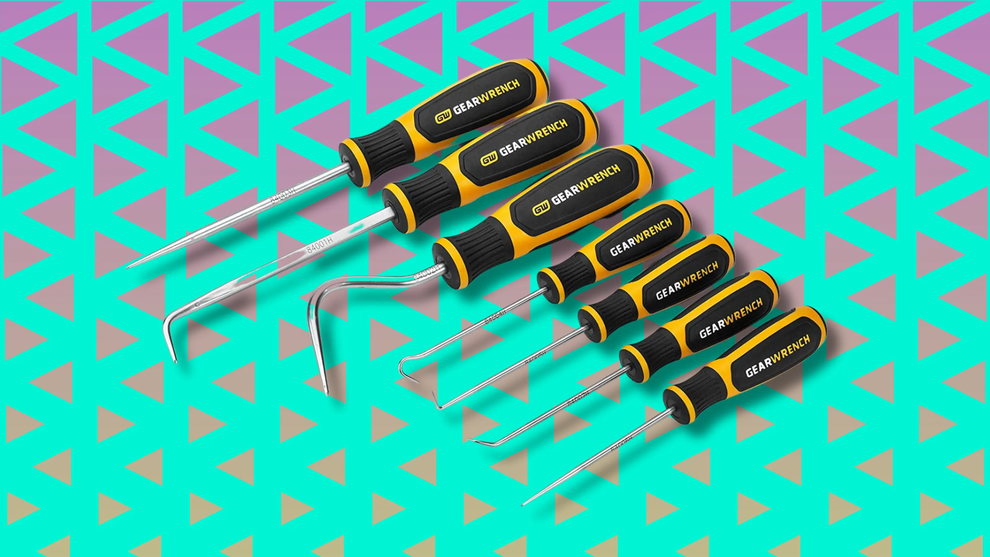 Set of yellow and black GearWrench screwdrivers on geometric background