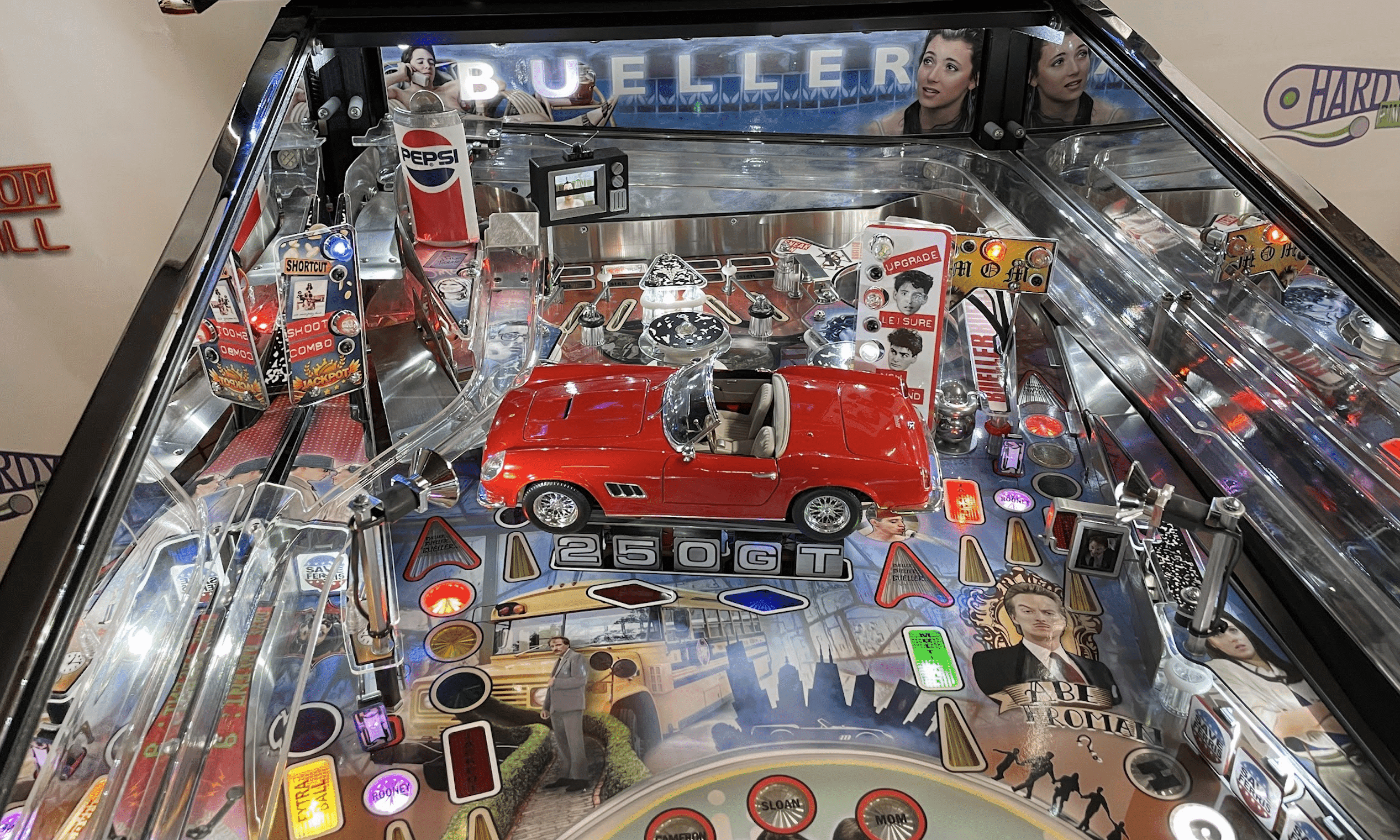 Detailed Bueller-themed pinball machine with red classic car and colorful elements