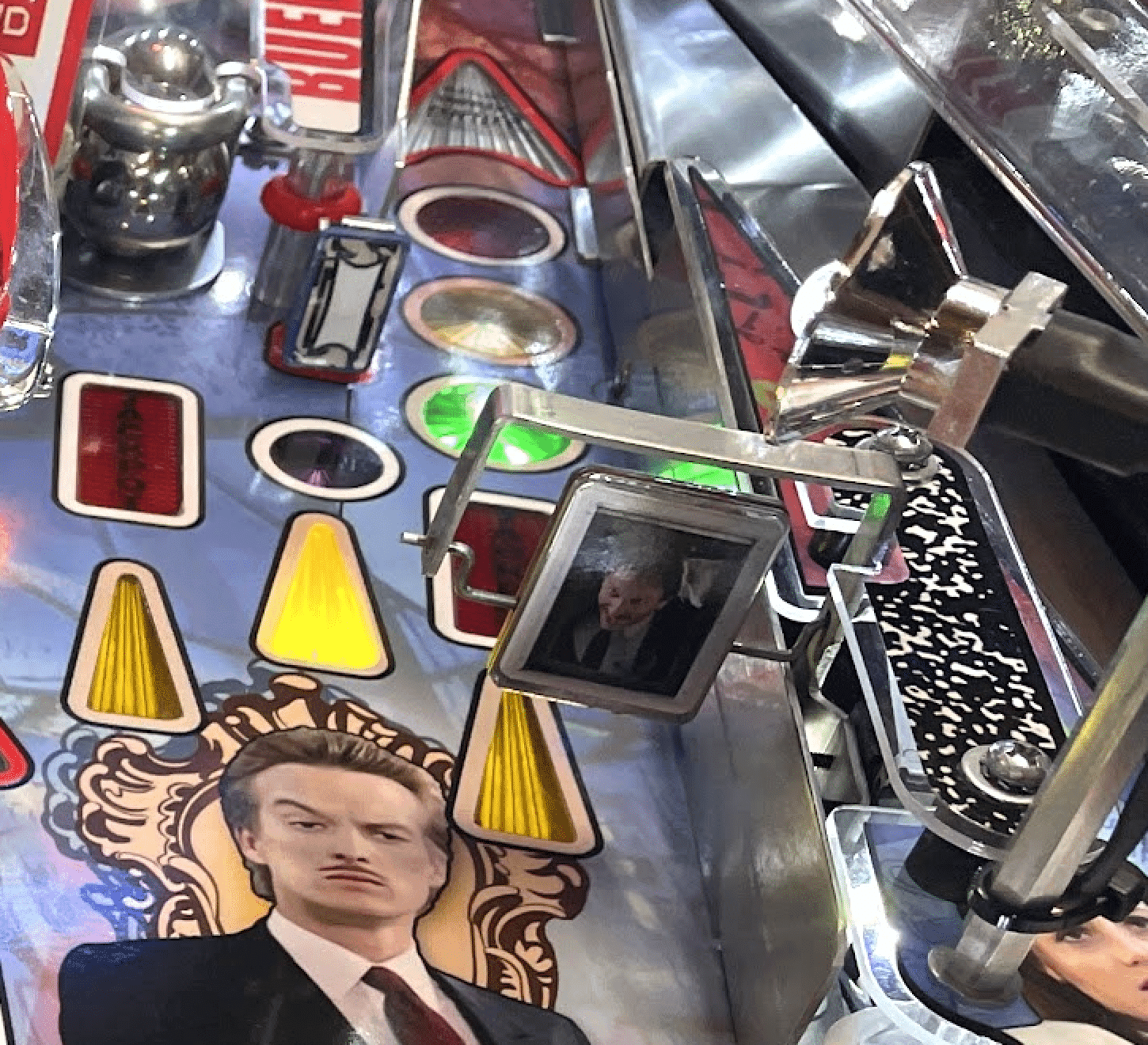 Pinball machine with graphic of man in suit and colorful yellow cones