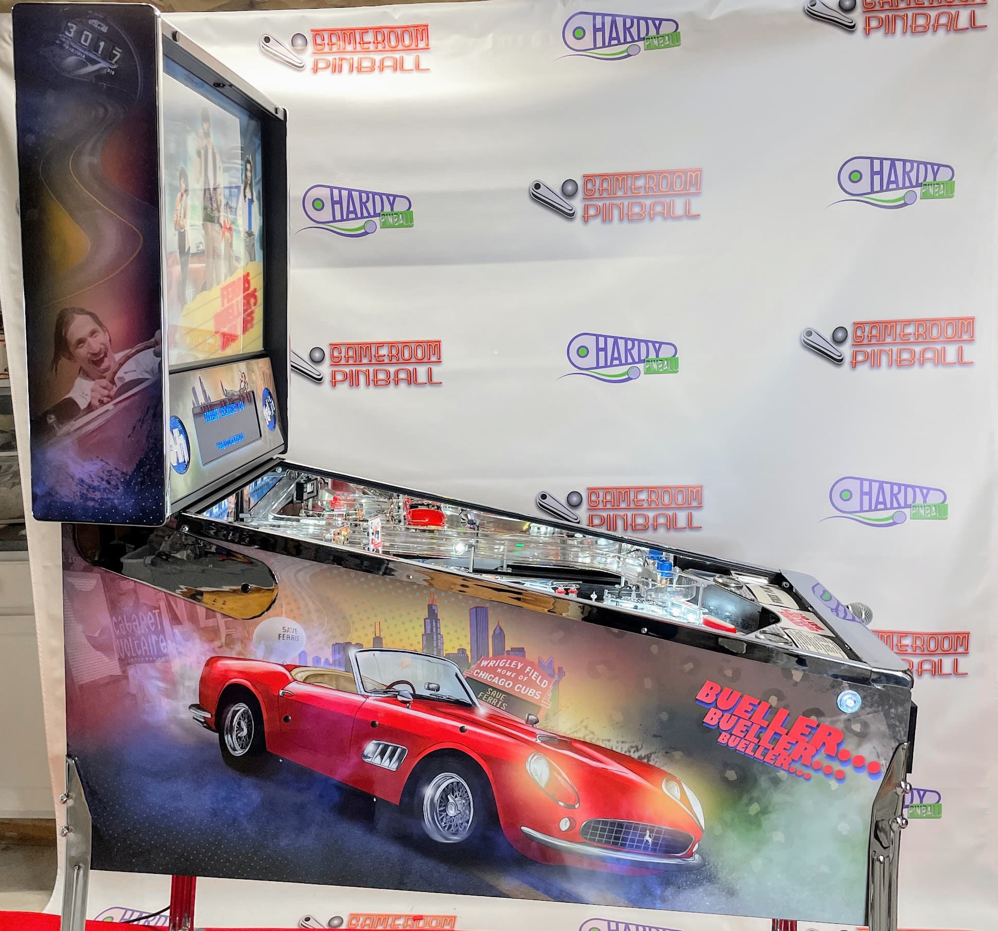 Classic red Ferrari pinball machine with Chicago skyline backdrop
