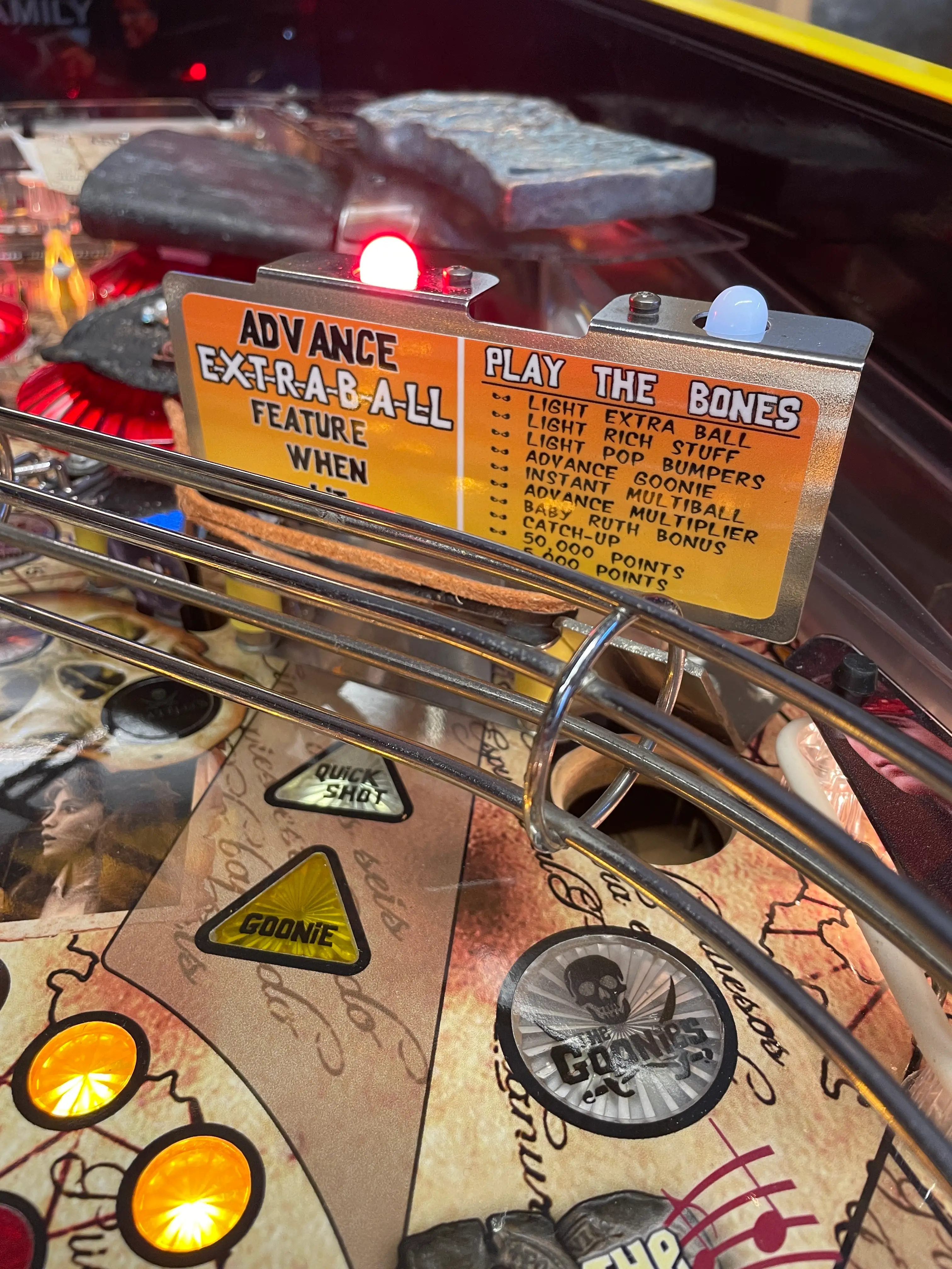 Close-up of Goonies pinball machine display showing game features