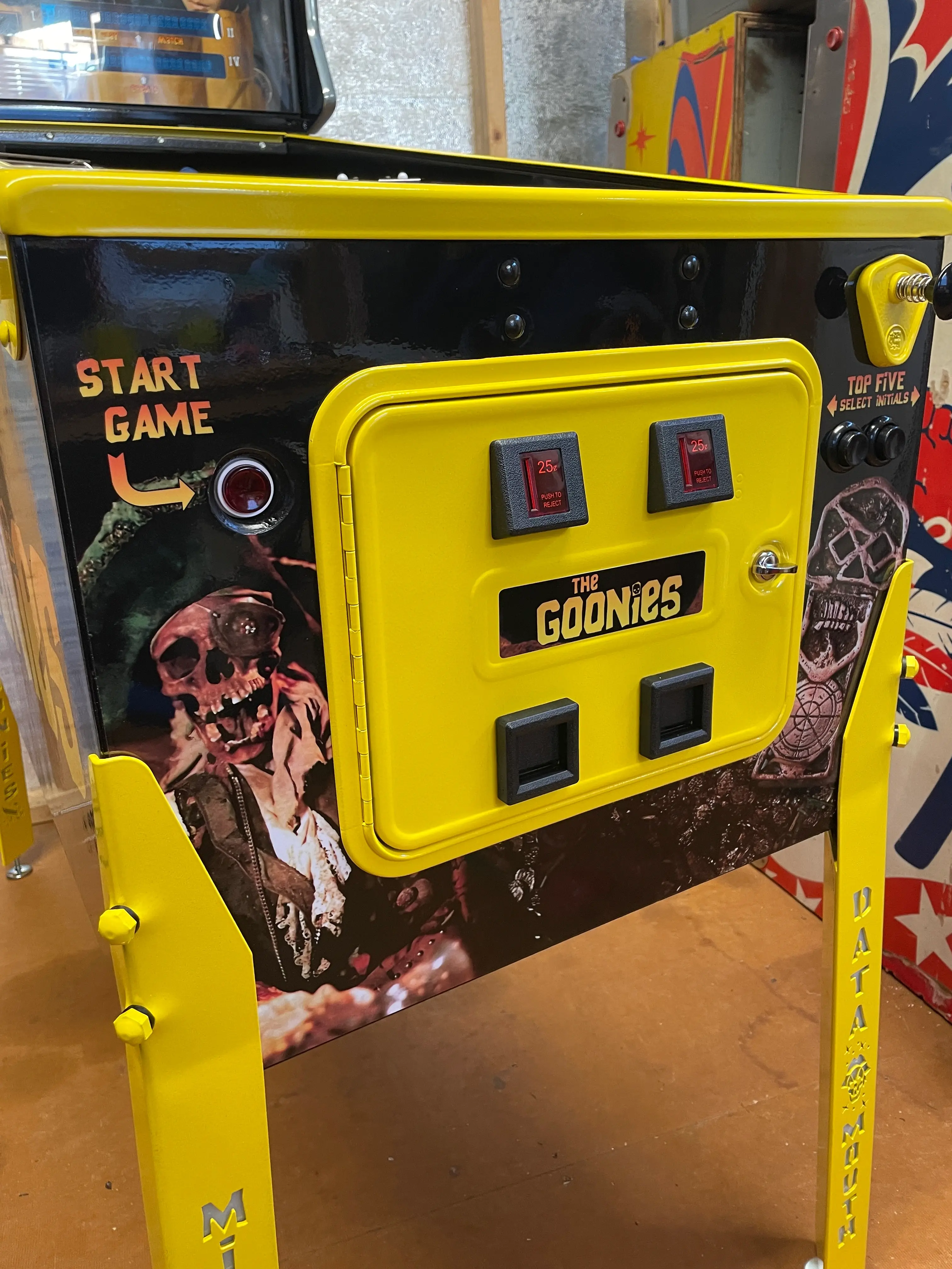 The Goonies arcade game with yellow control panel and start button