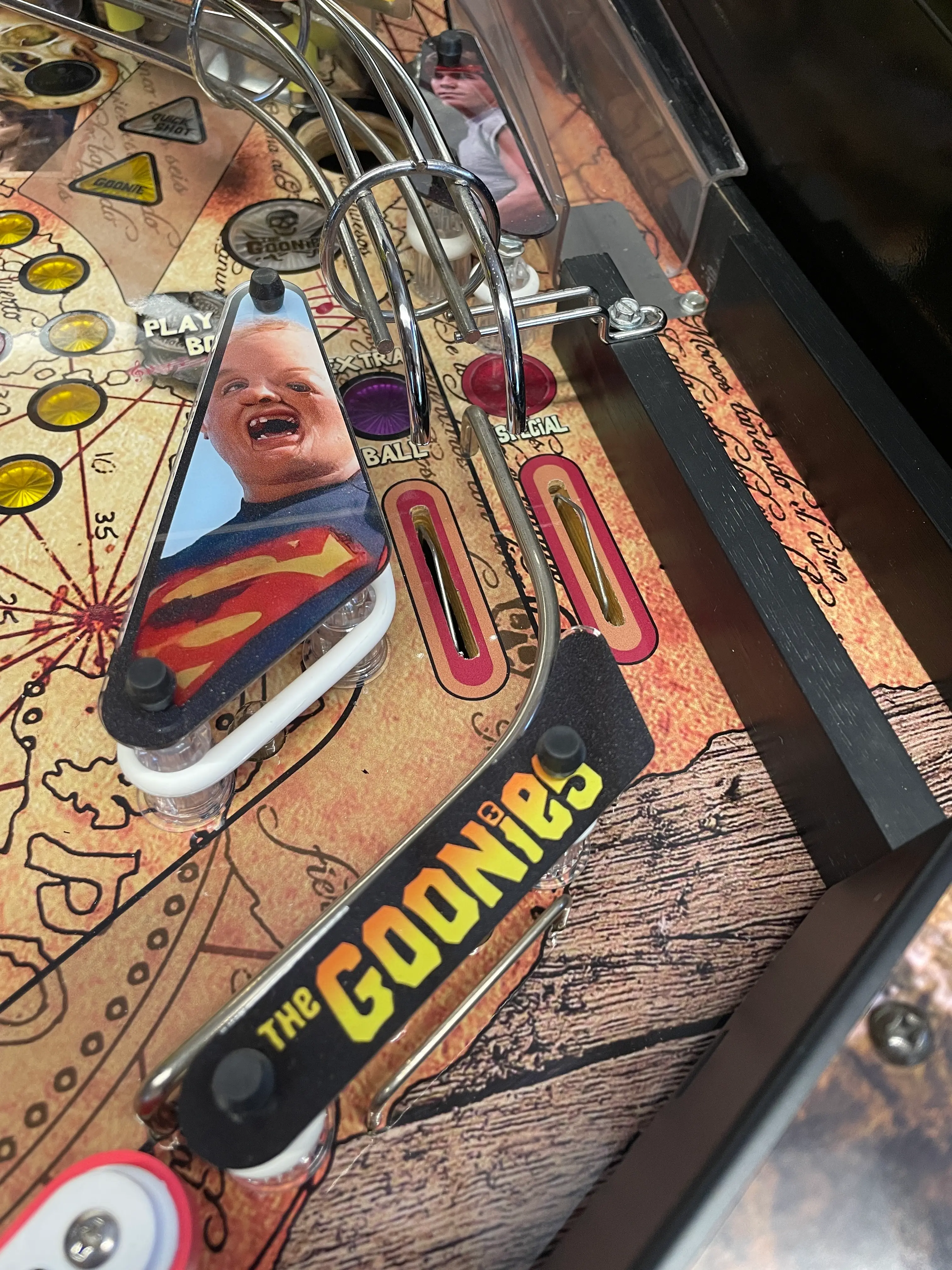 Vintage Goonies pinball machine with Superman character on playfield