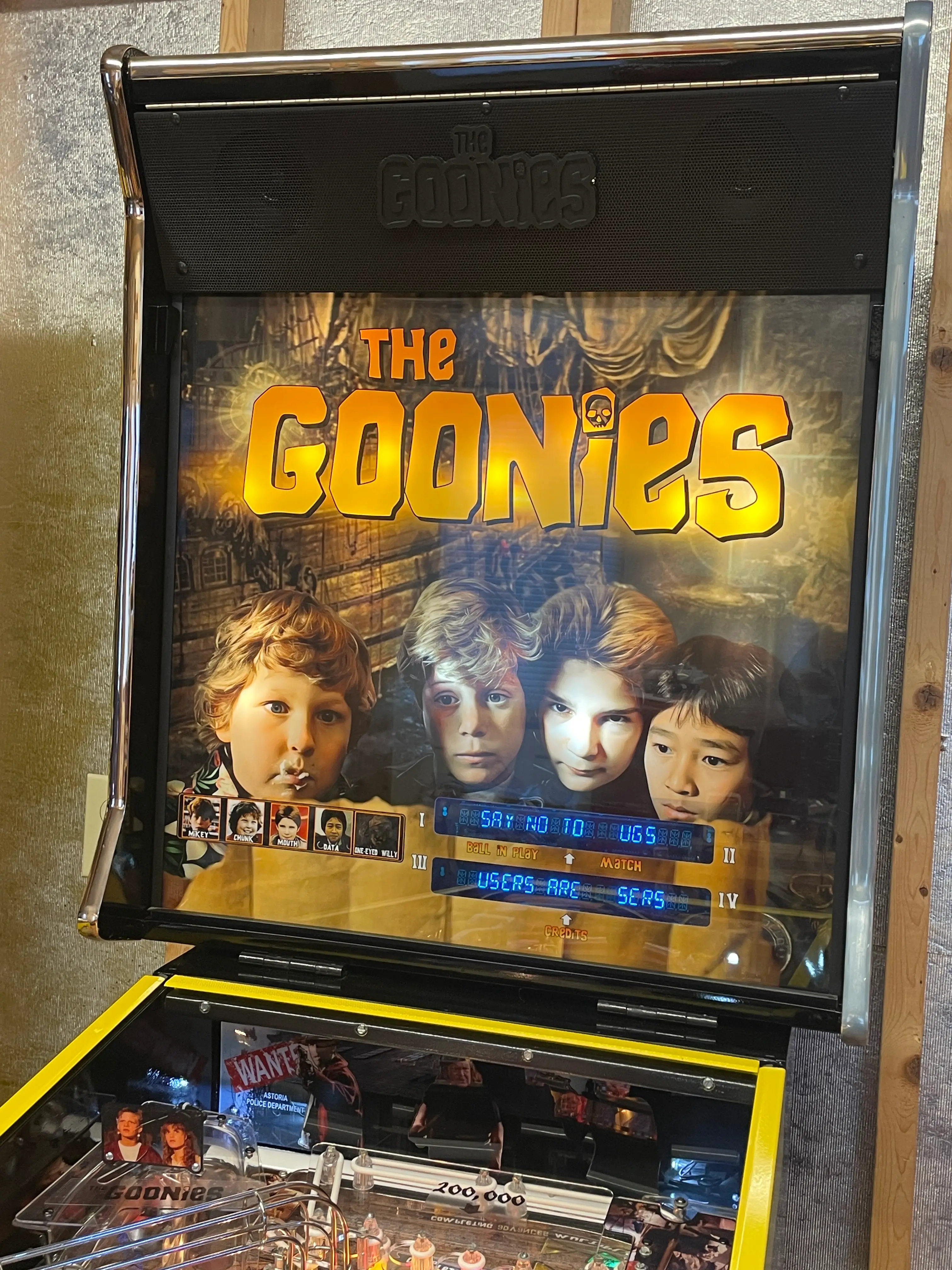 The Goonies pinball machine with movie poster and game display