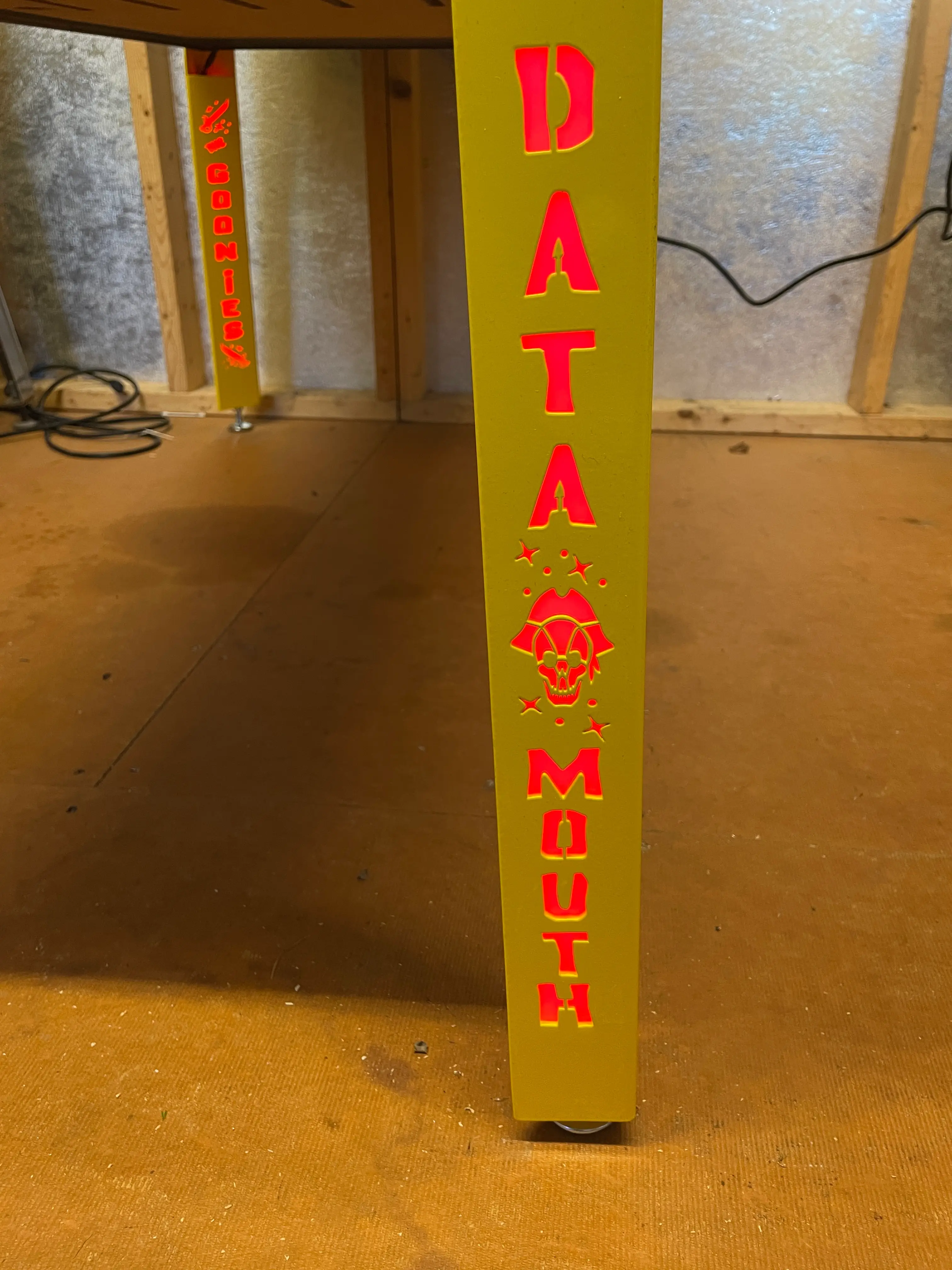 Bright yellow column with red "DATA MOUTH" text and skull graphic