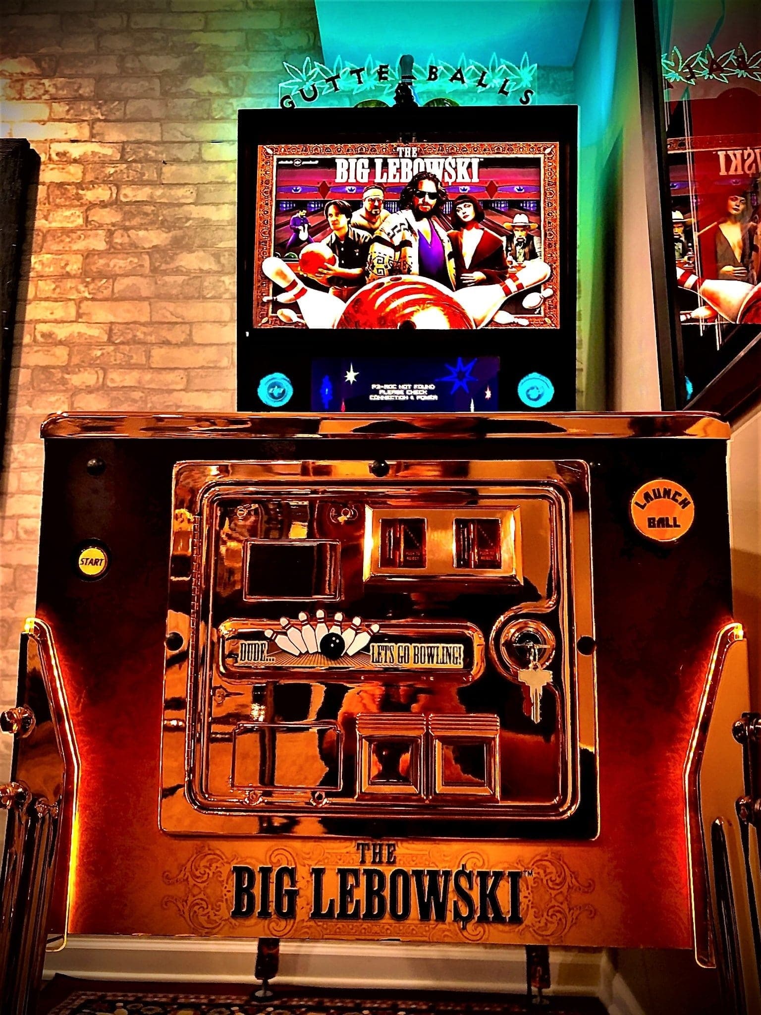 The Big Lebowski pinball machine with movie poster and colorful arcade display