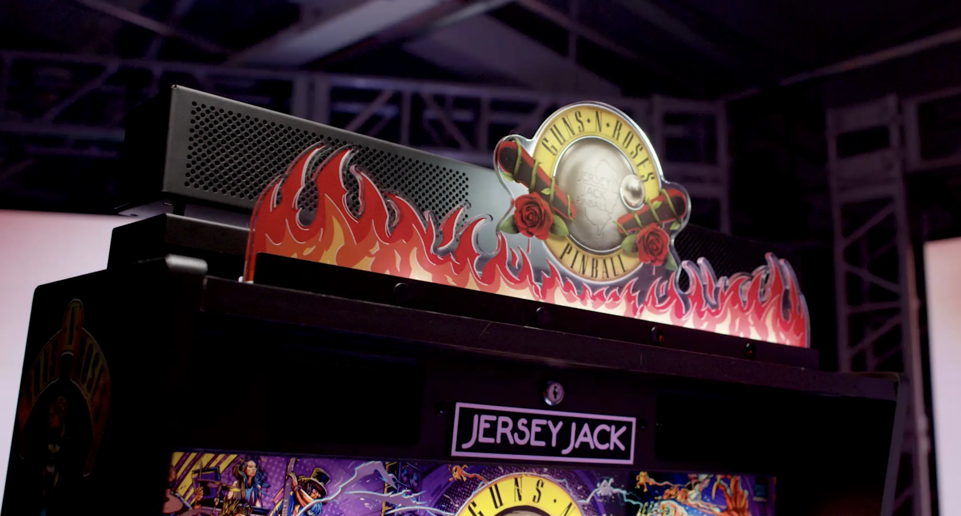 Guns N' Roses pinball machine with flames and logo at arcade