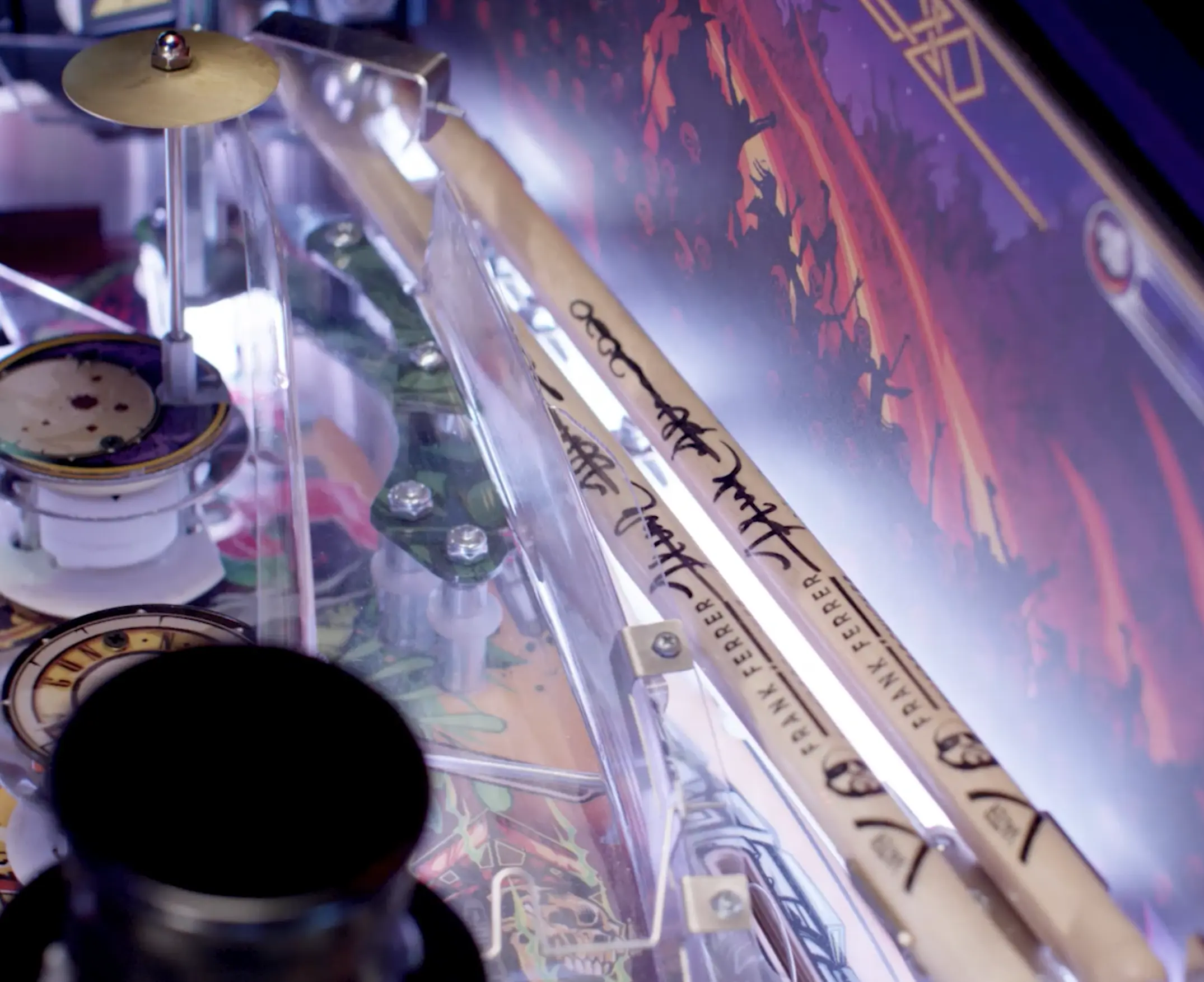 Drumsticks, cymbal, and clock on a blurry musical instrument display
