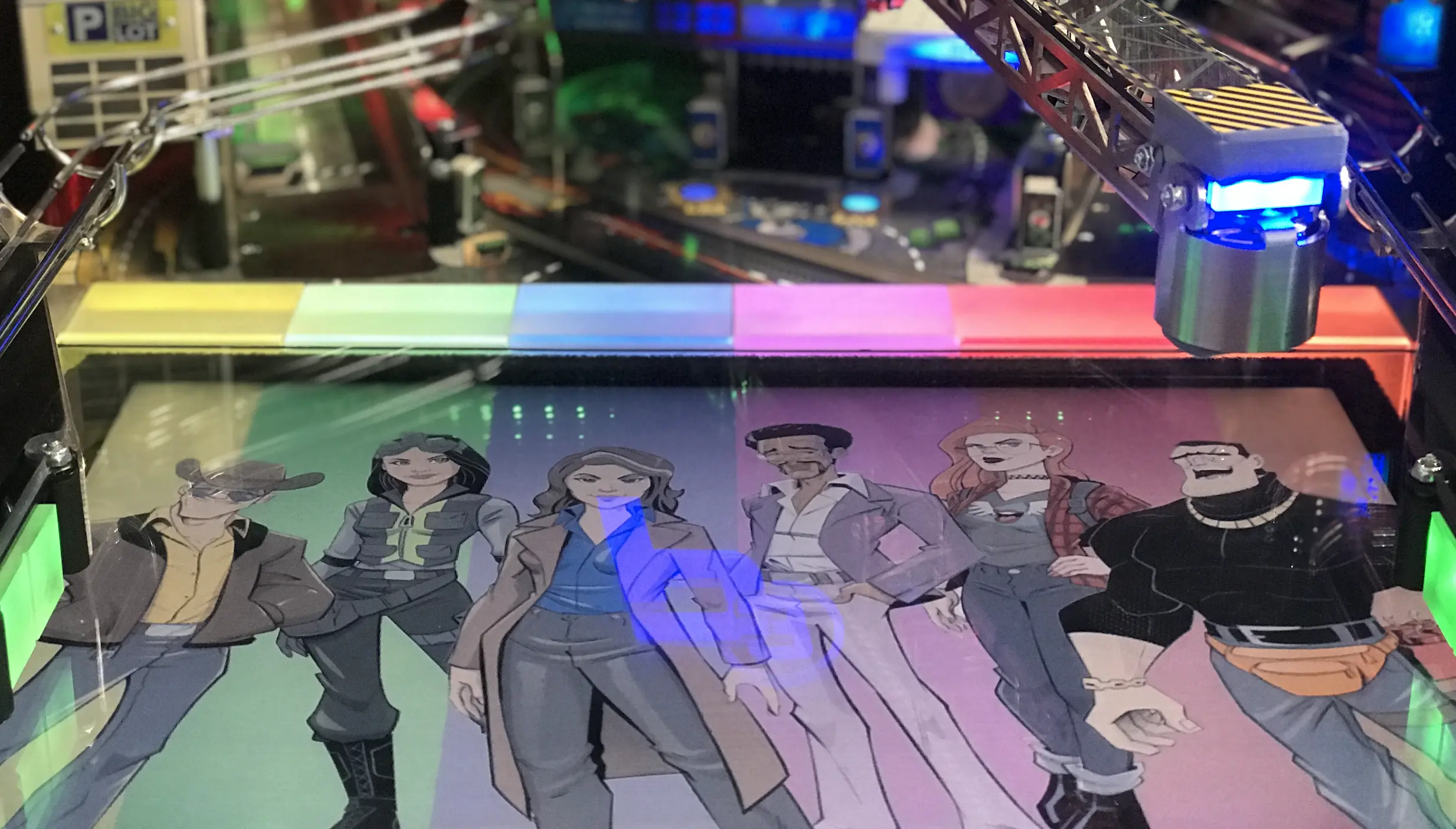 Cartoon characters standing in a row under colorful lighting and technical equipment