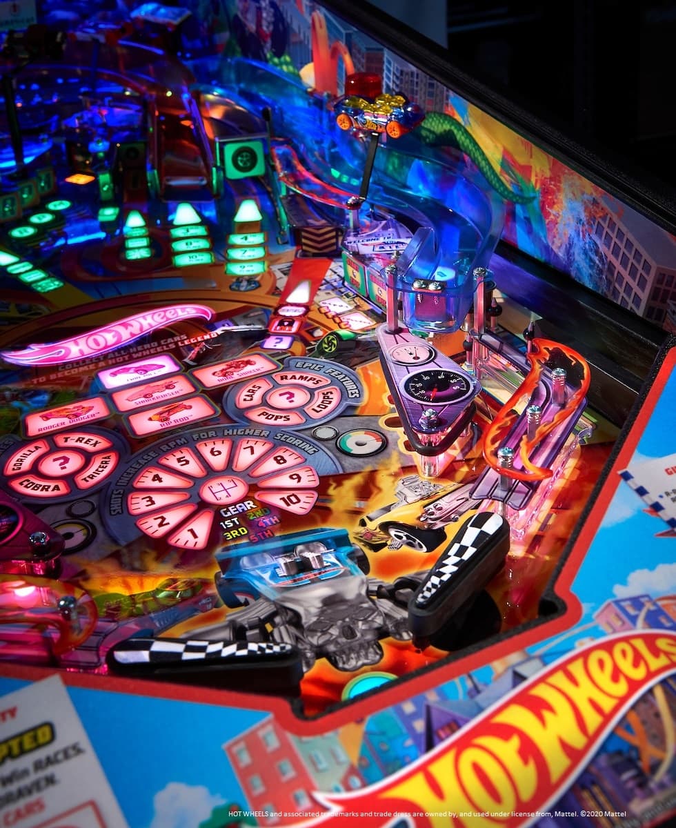 Colorful Hot Wheels pinball machine with vibrant lights and racing elements