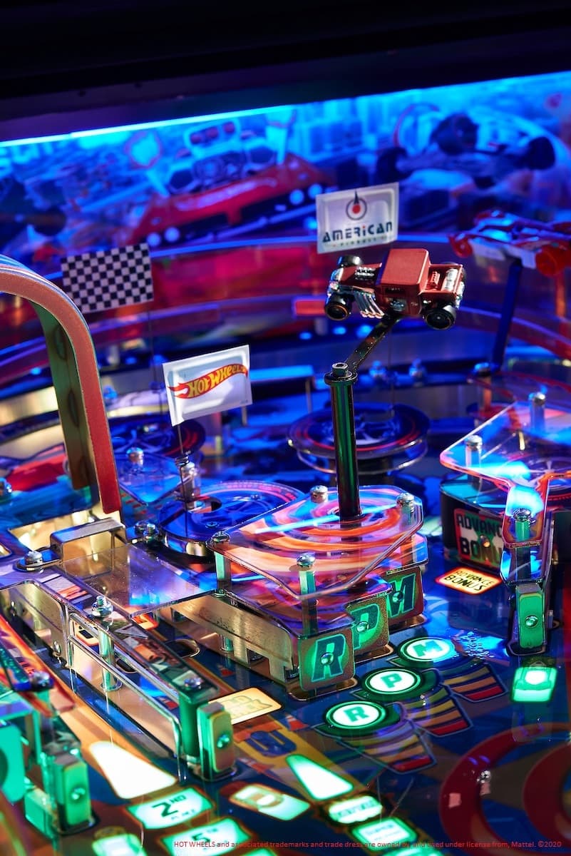 Colorful Hot Wheels pinball machine with vibrant blue and green lights
