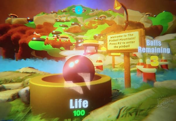 Colorful pinball mountain game scene with life meter and welcome sign